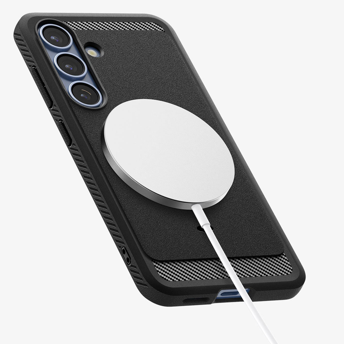 Czarny smartfon w etui ochronnym ładowany bezprzewodowo za pomocą białej ładowarki magnetycznej.
