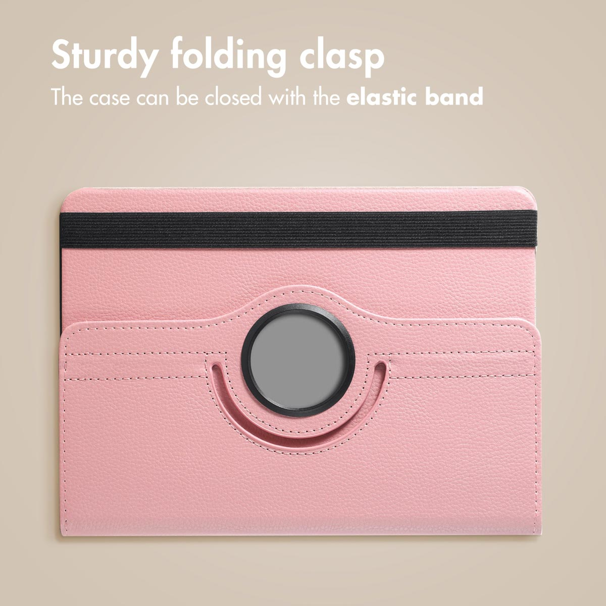 Pink tablet case with black elastic band and central round logo against a beige background.