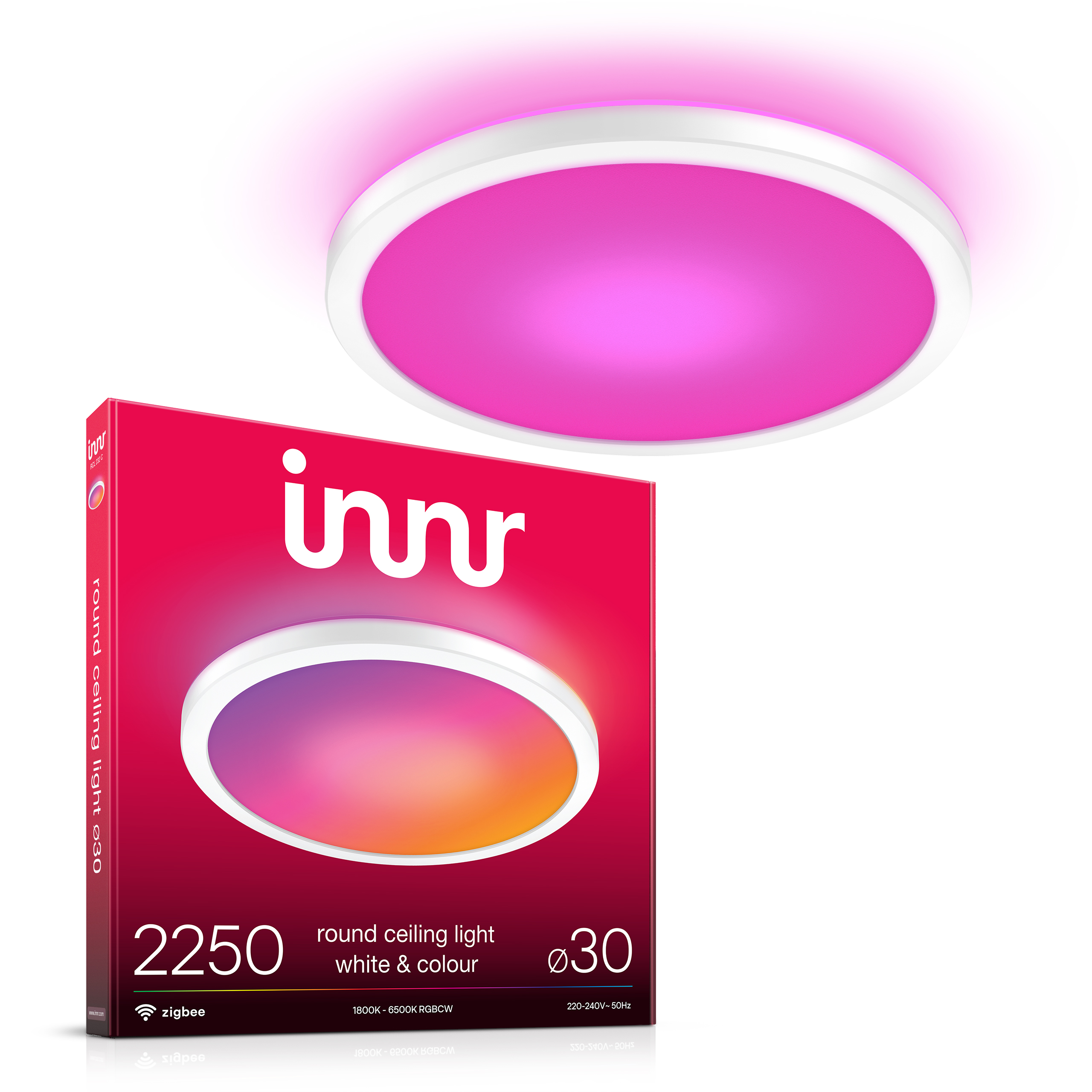 Una scatola per plafoniera rotonda Innr con l'apparecchio attivo sopra, che emette una luce rosa brillante.