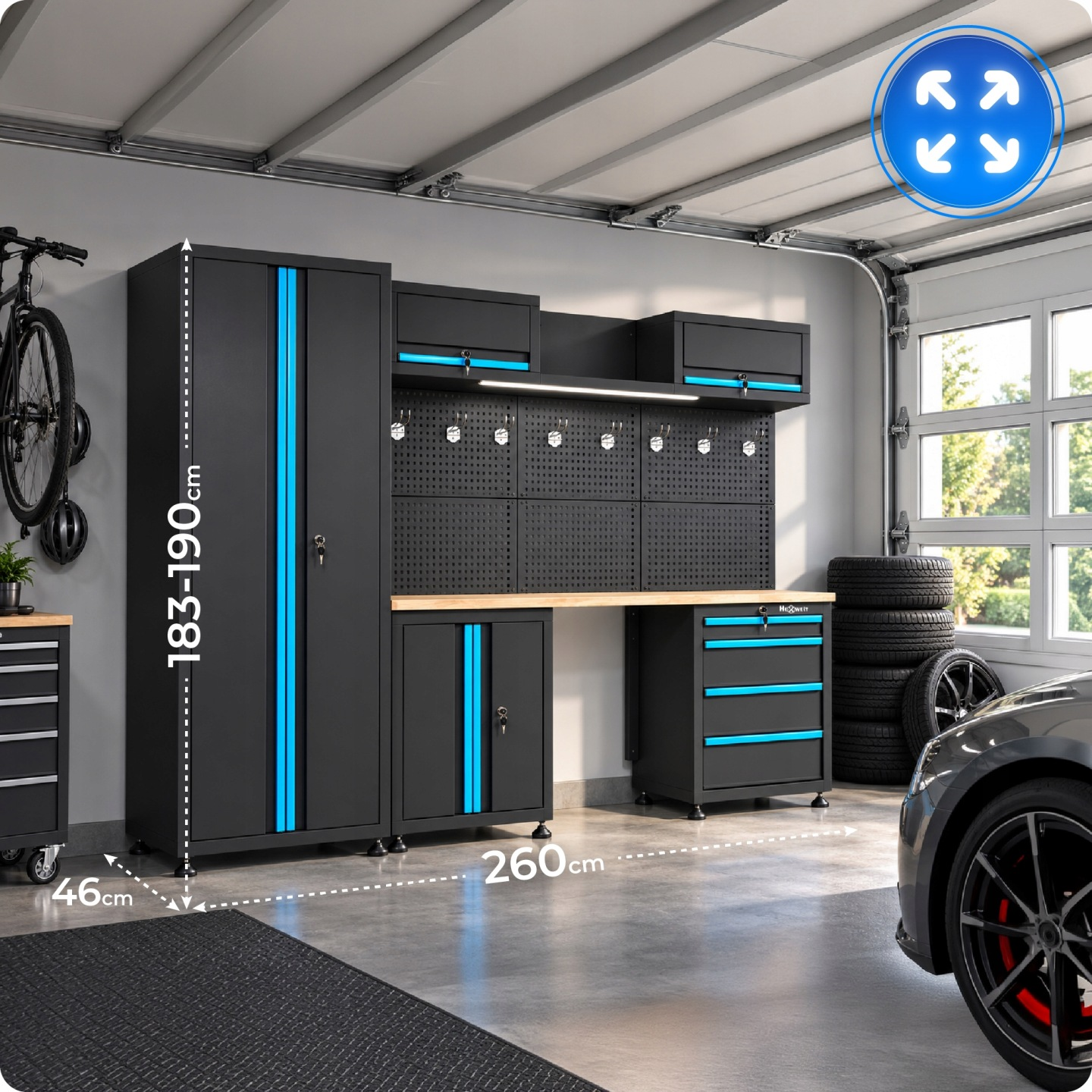 Ein schwarz-blaues Garagenregalsystem mit Werkbank, Schränken und Lochwand in einer Garage.