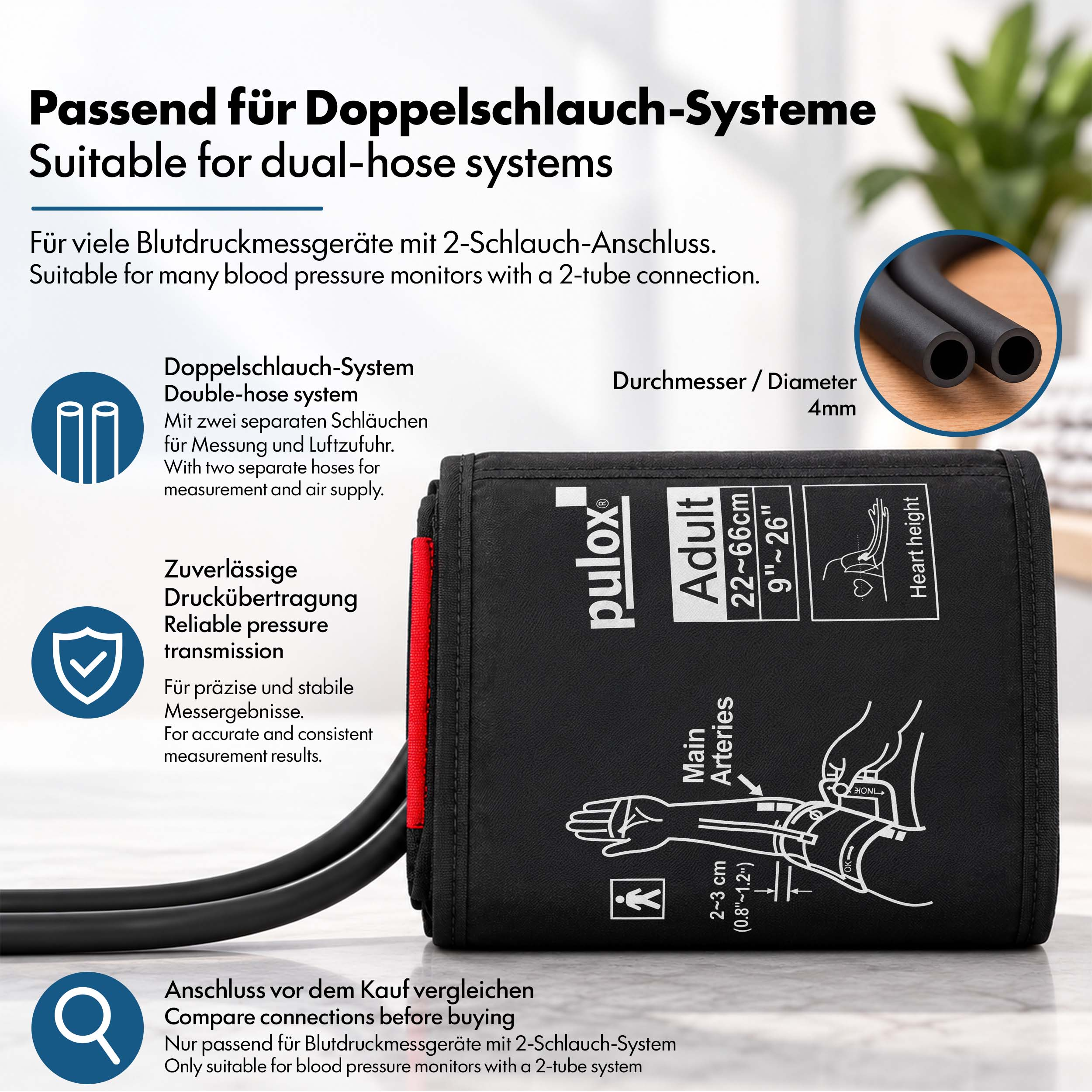 Eine schwarze Erwachsenen-Blutdruckmanschette mit Doppelschlauch, Text und Symbolen auf Marmor.