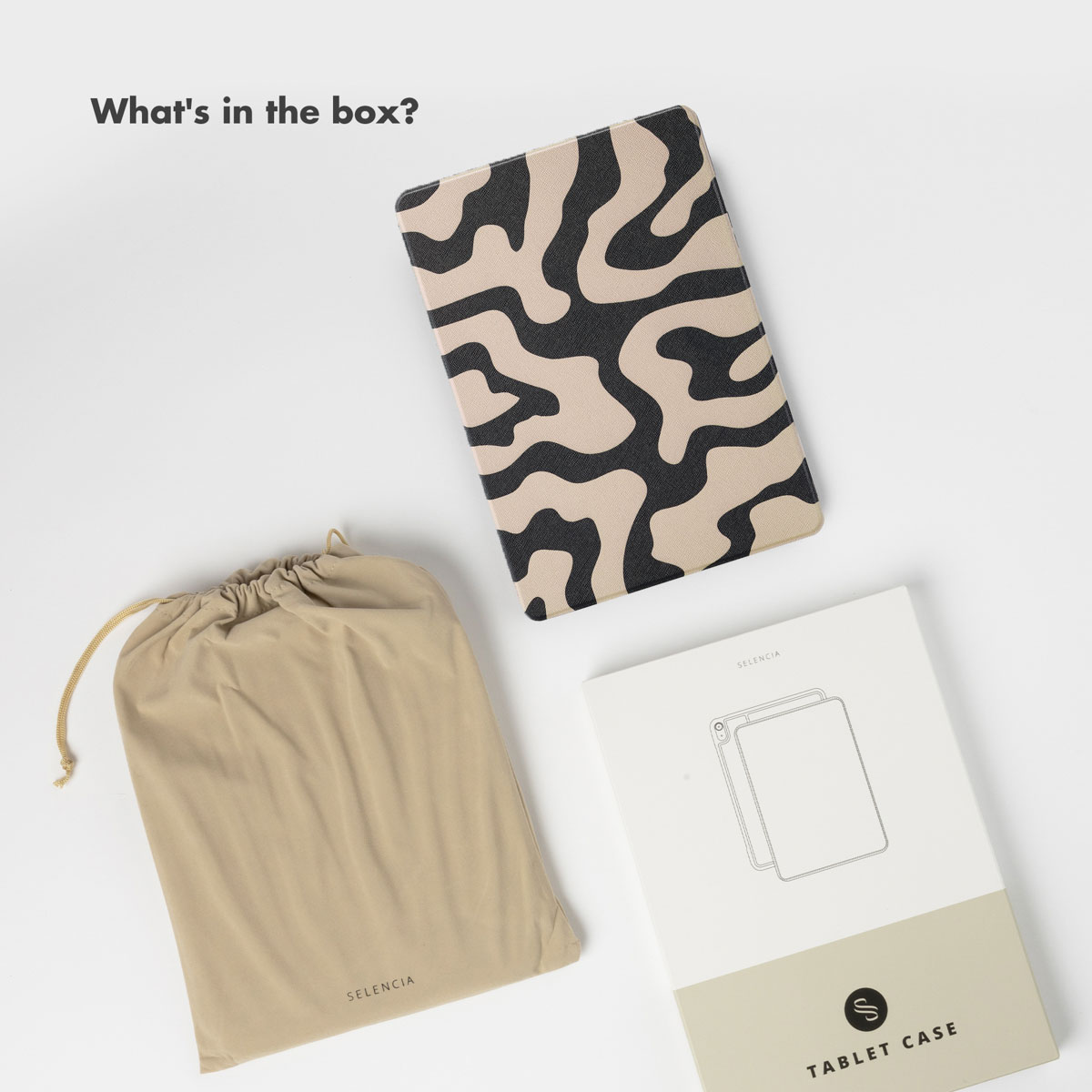 A tablet case with black and beige abstract pattern, a beige drawstring pouch, and a white box labeled "Tablet Case".