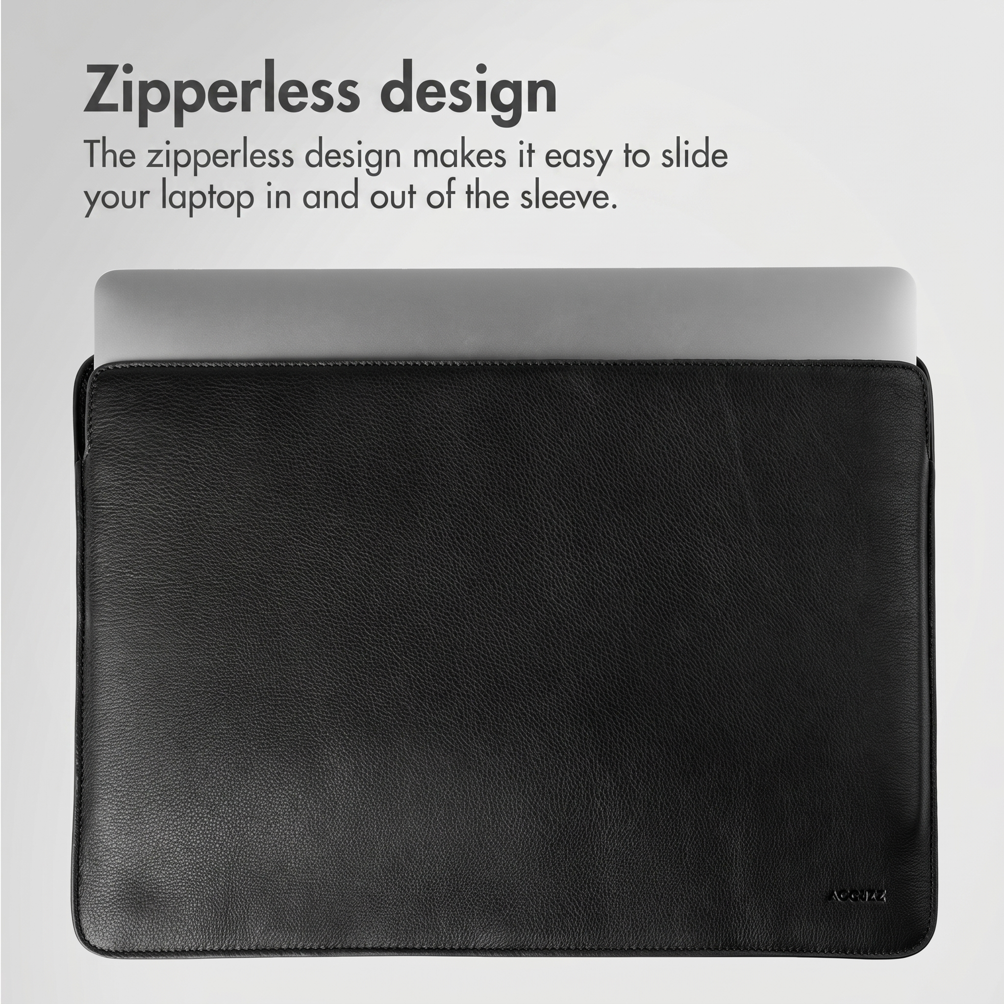 Una laptop se desliza en una funda de cuero negro, destacando un diseño sin cremallera.