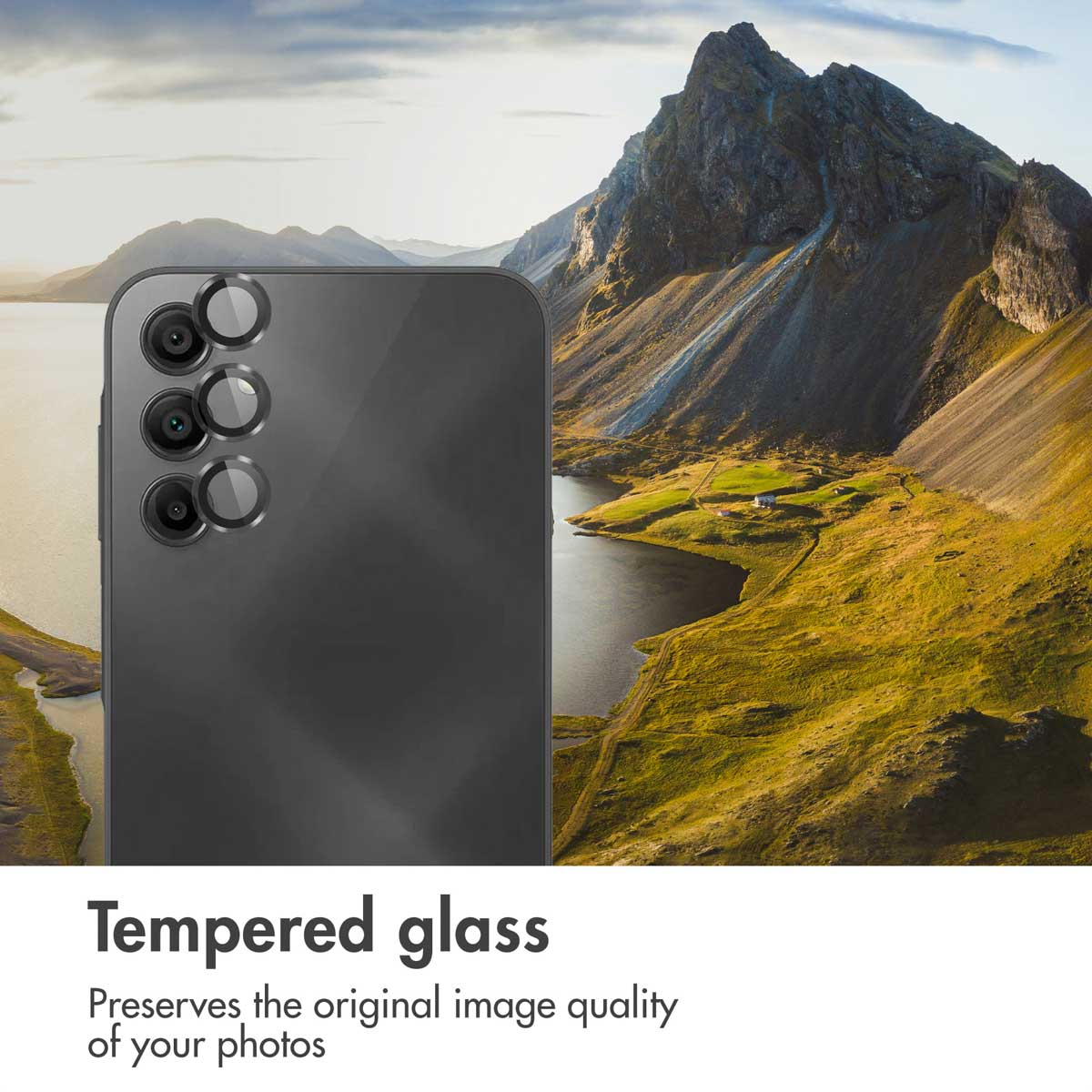 A smartphone with camera lens protectors, overlaid on a scenic mountain landscape with a lake.