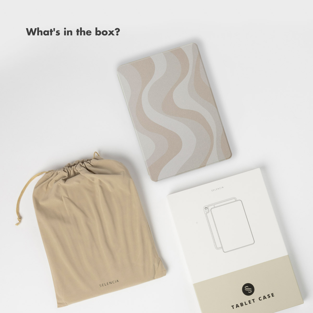 A wavy patterned tablet case, beige pouch bag, and labeled packaging are arranged on a white surface.