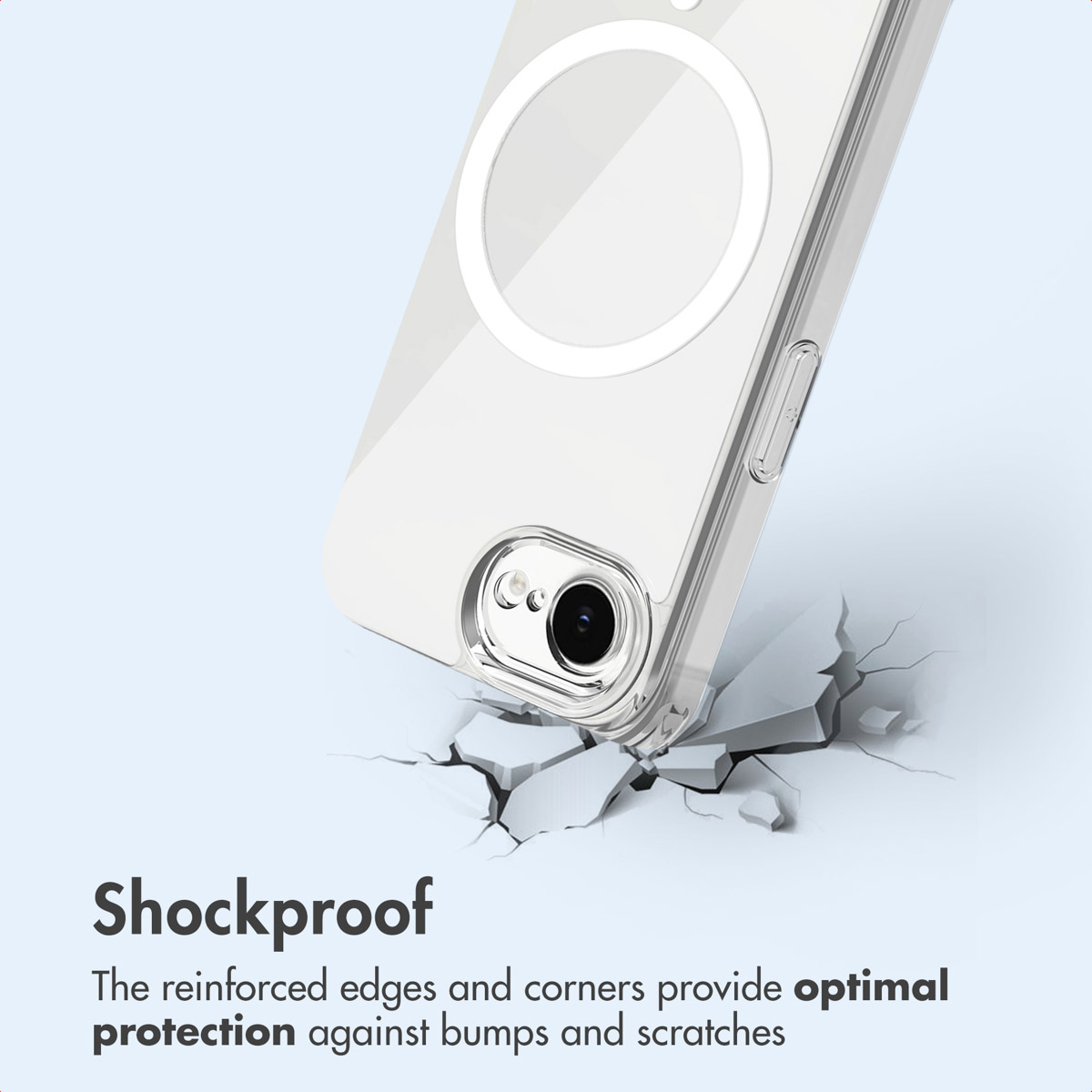 Funda transparente para teléfono con anillo MagSafe sobre una superficie agrietada.