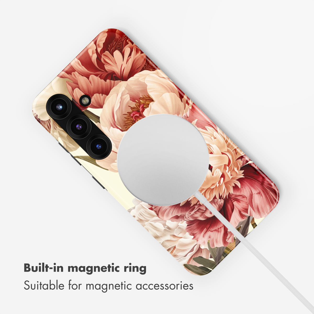 Una funda de teléfono con peonías rojas y blancas y un anillo de carga magnético.