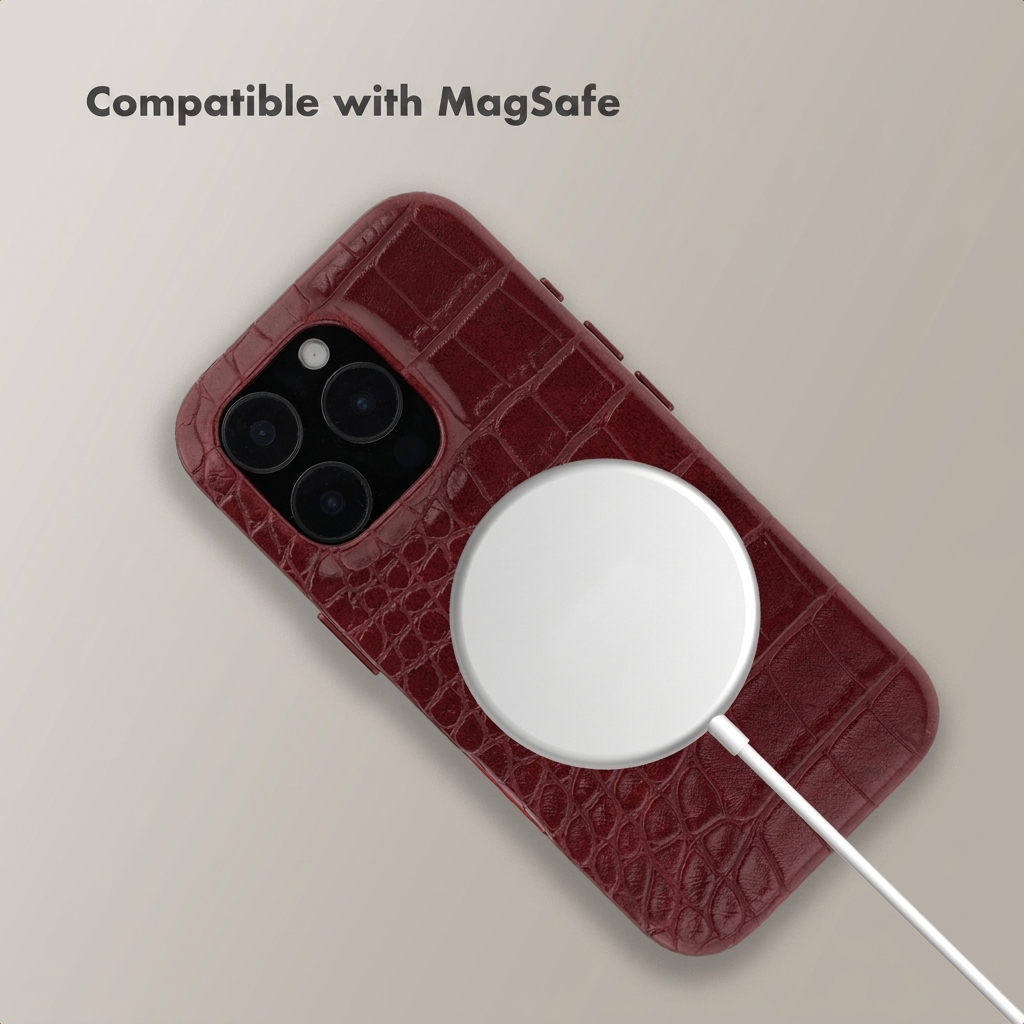 MagSafe-compatible red crocodile leather phone case with charging pad.