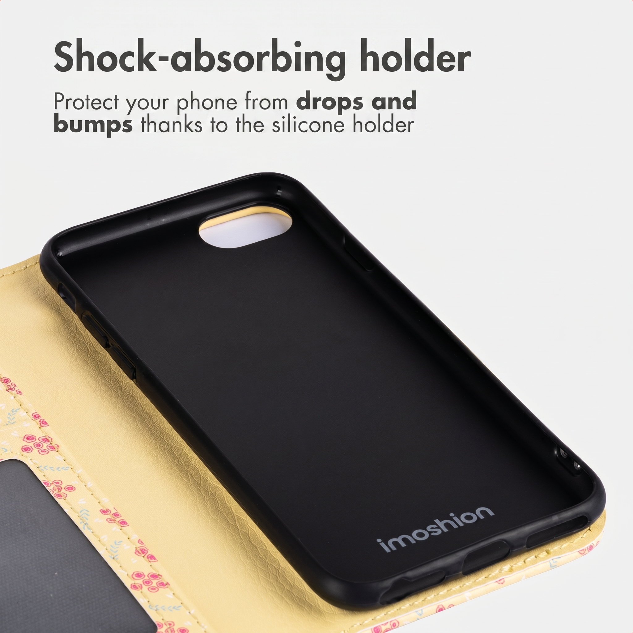 Un supporto per telefono in silicone nero antiurto in una custodia a portafoglio floreale.