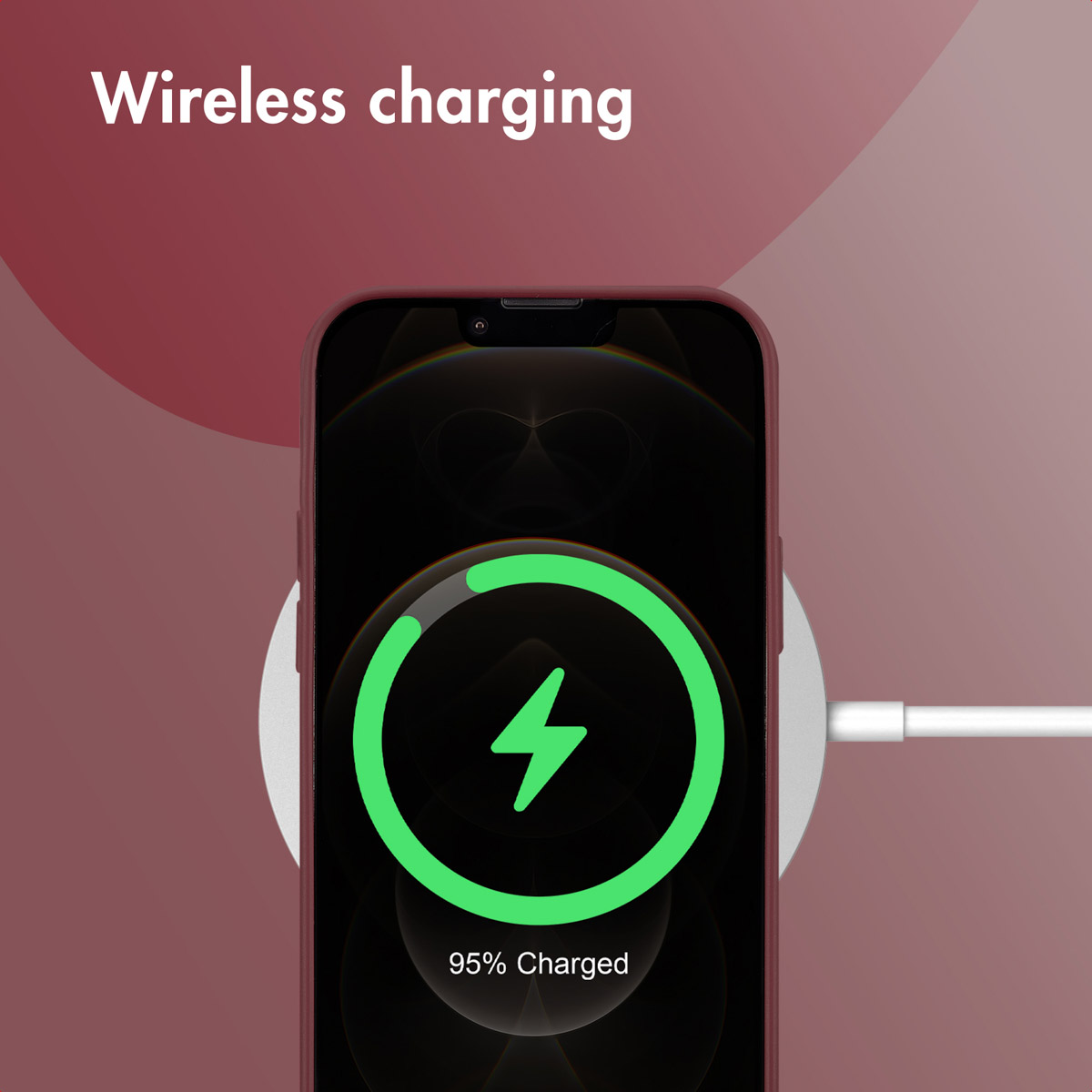 Un smartphone sur un socle de charge sans fil sur fond rouge avec le texte Wireless charging.