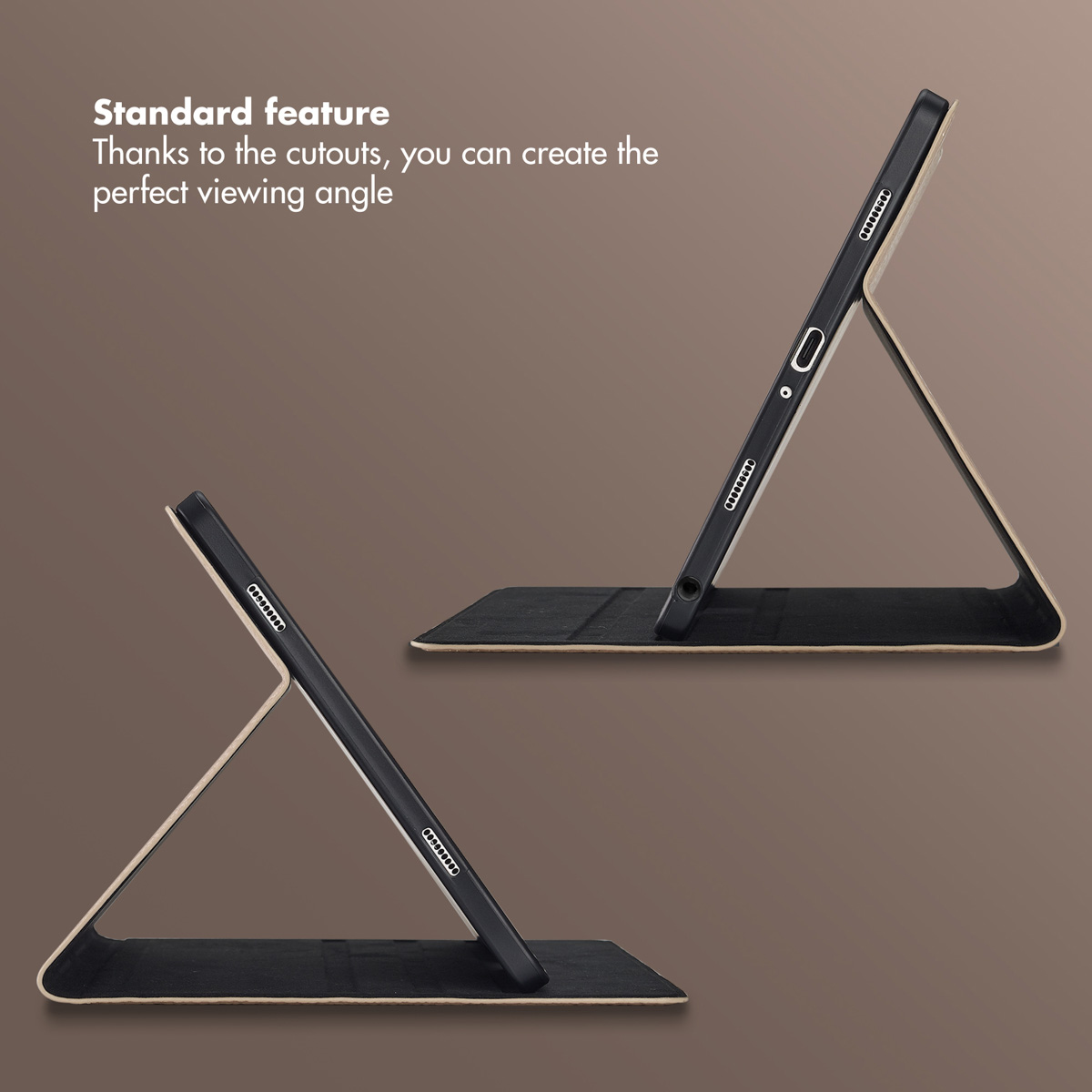 Two tablets supported by leather case stands on a brown background.