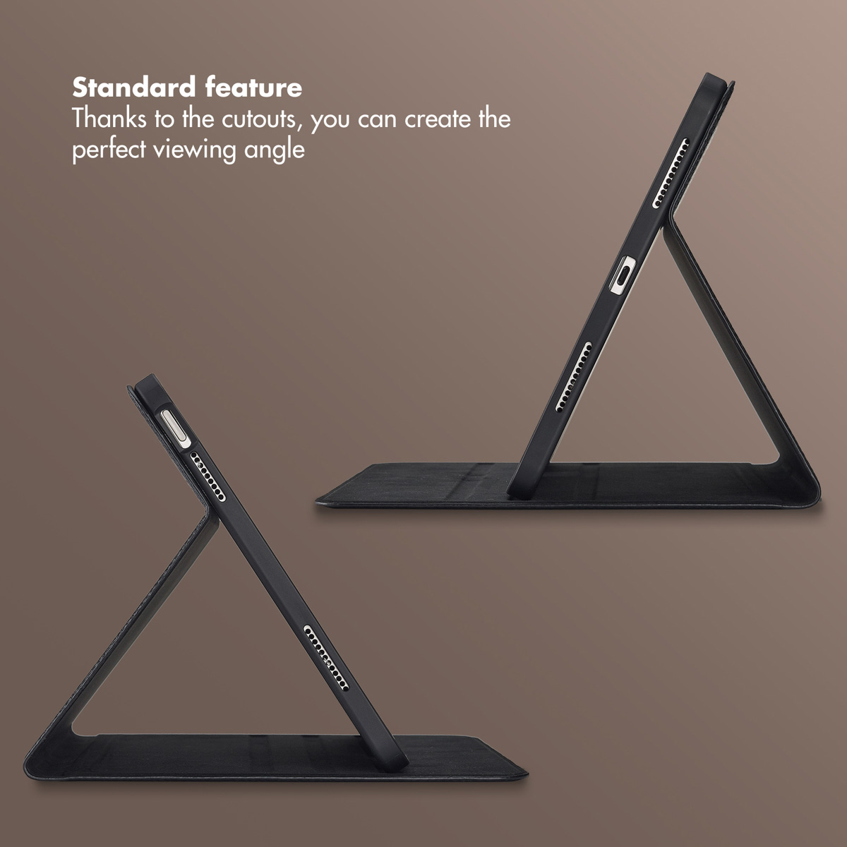 Two tablets in black cases stand at an angle on a brown surface.
