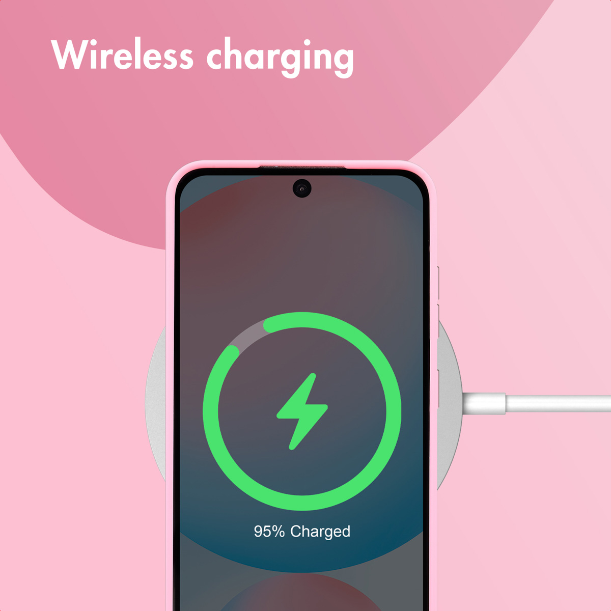 A pink smartphone on a wireless charging pad showing 95% charged.