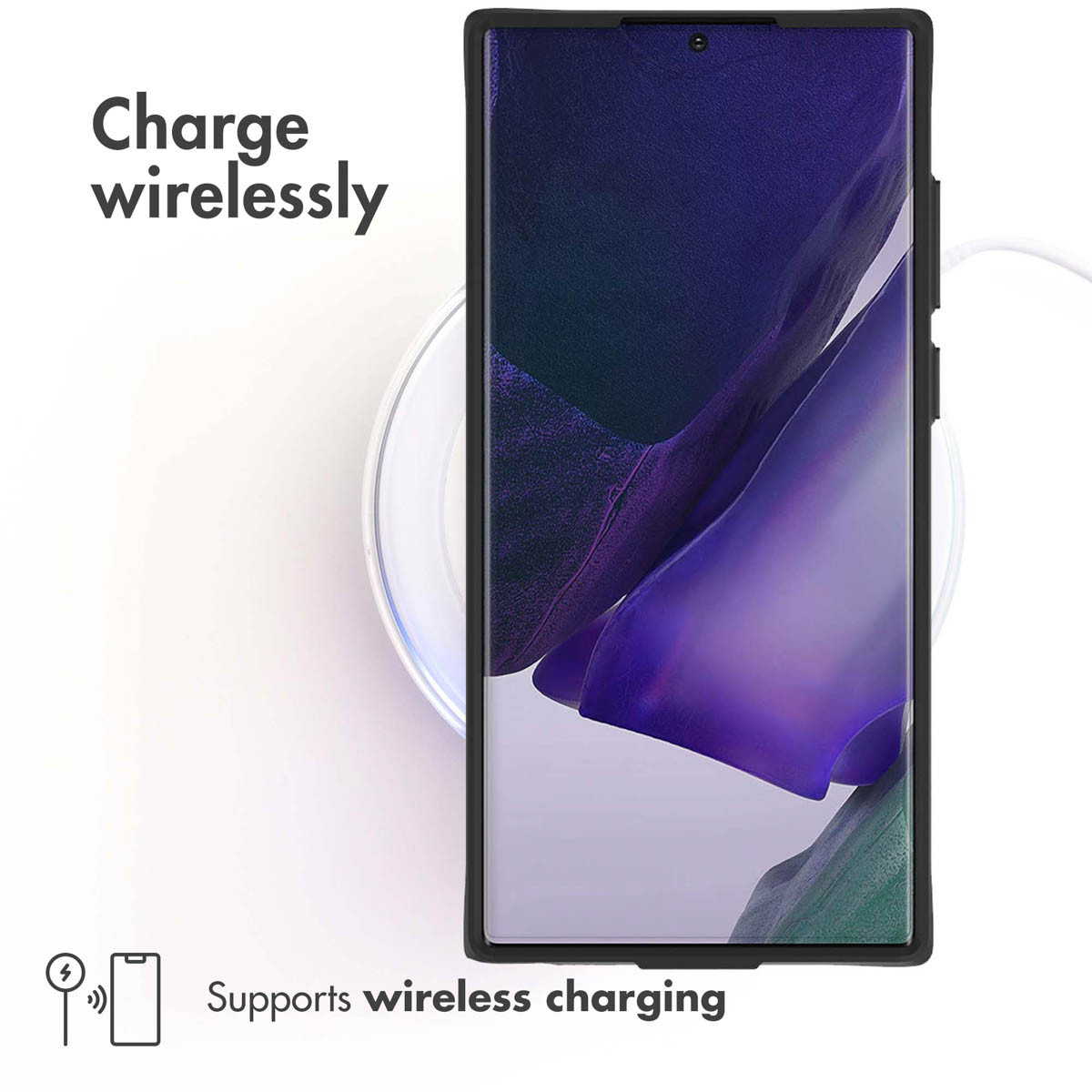 Un smartphone repose sur un chargeur sans fil rond avec du texte.