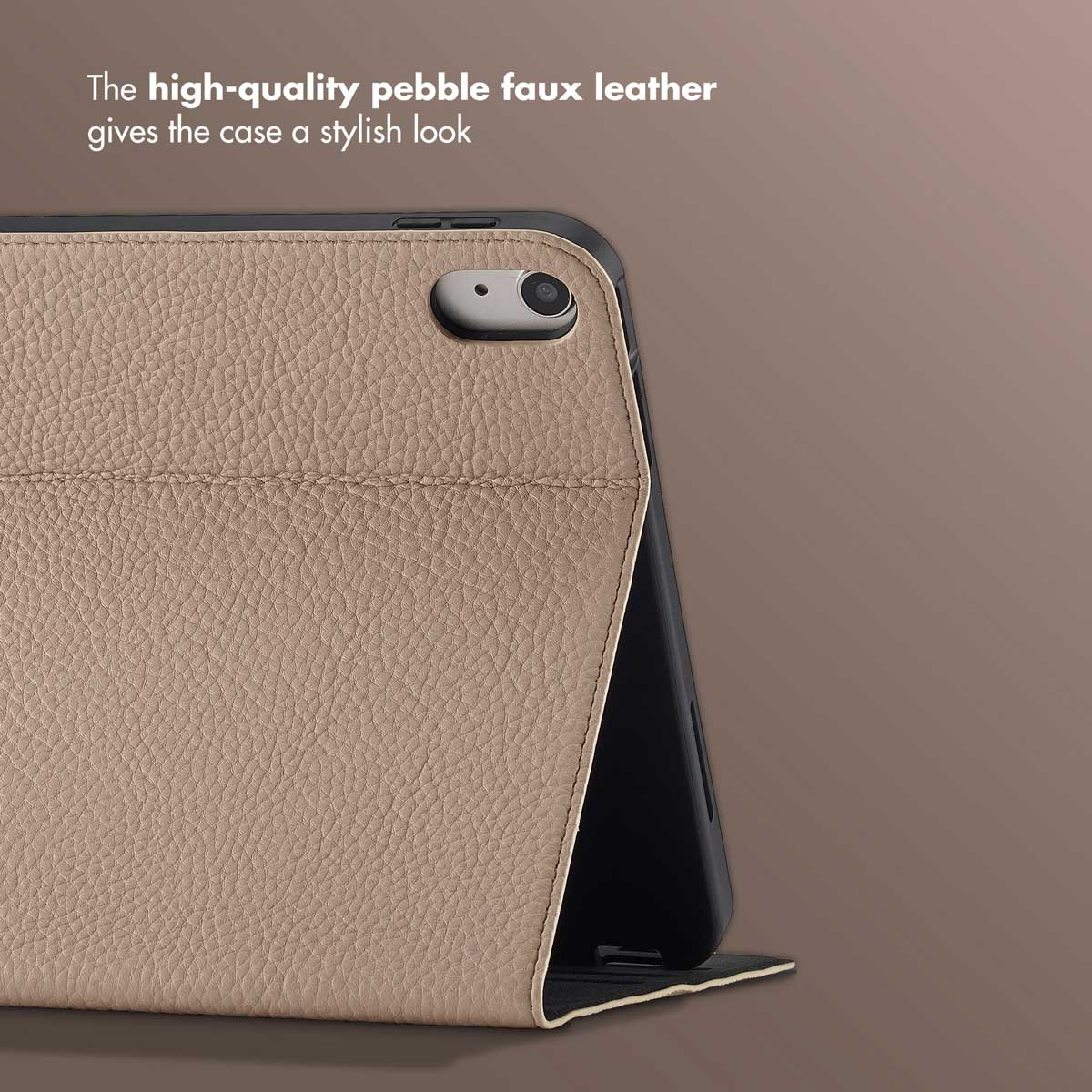 Close-up of a tablet in a beige pebbled faux leather case, showing the camera cutout and textured surface.