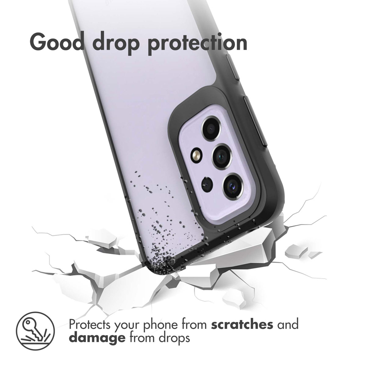 Un smartphone violet dans une coque noire heurte des surfaces blanches fissurées.