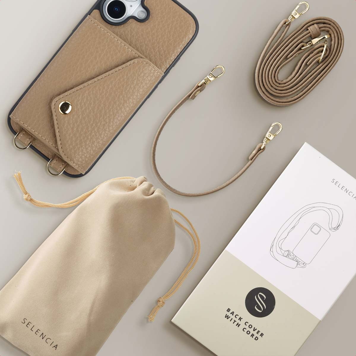 Custodia per telefono beige con tasca, cinturino, cordino, sacchetto e confezione.