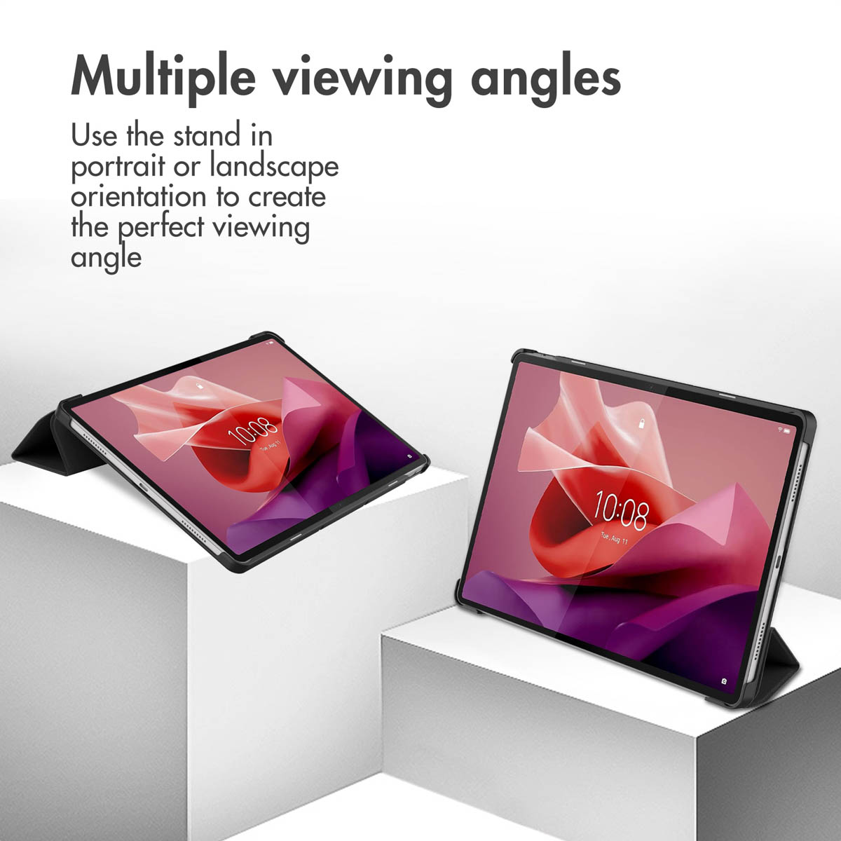 Two tablets in stands on white pedestals show different viewing angles.