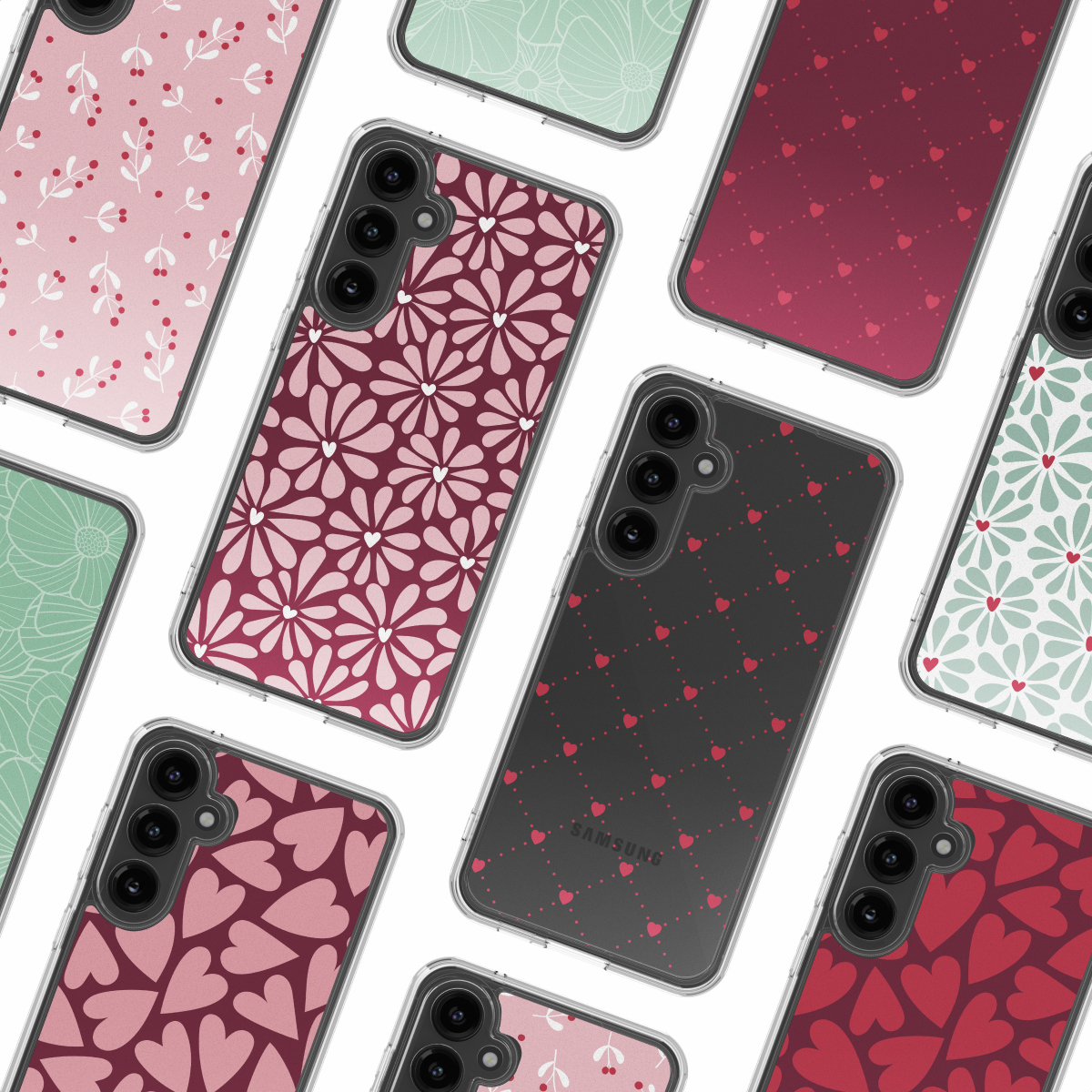 Eine Aufsicht auf verschiedene gemusterte Smartphone-Hüllen mit Blumen, Herzen und Punkten auf weißem Grund.