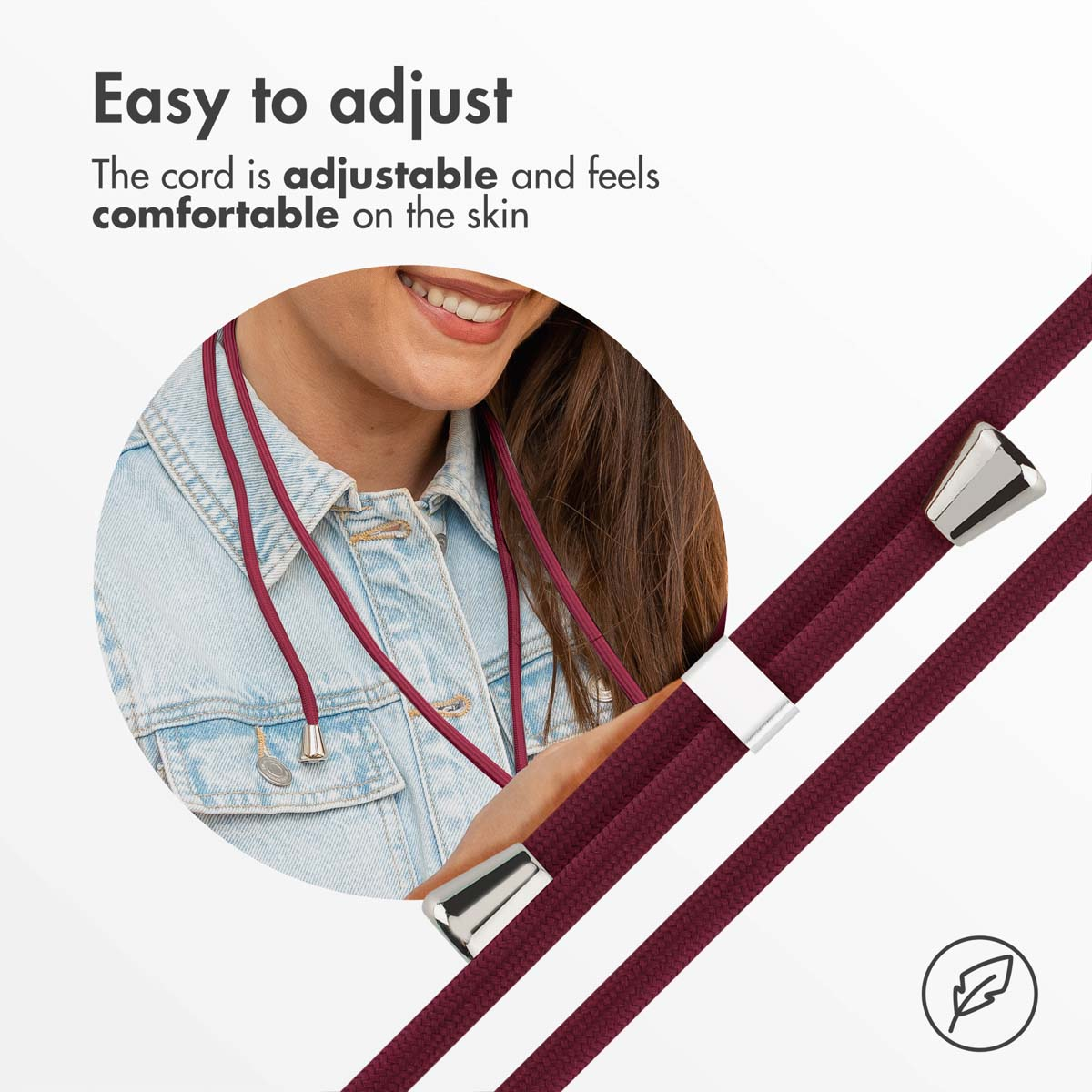 Una persona lleva un collar de cordón burdeos, con primeros planos de los extremos ajustables metálicos y camisa vaquera.
