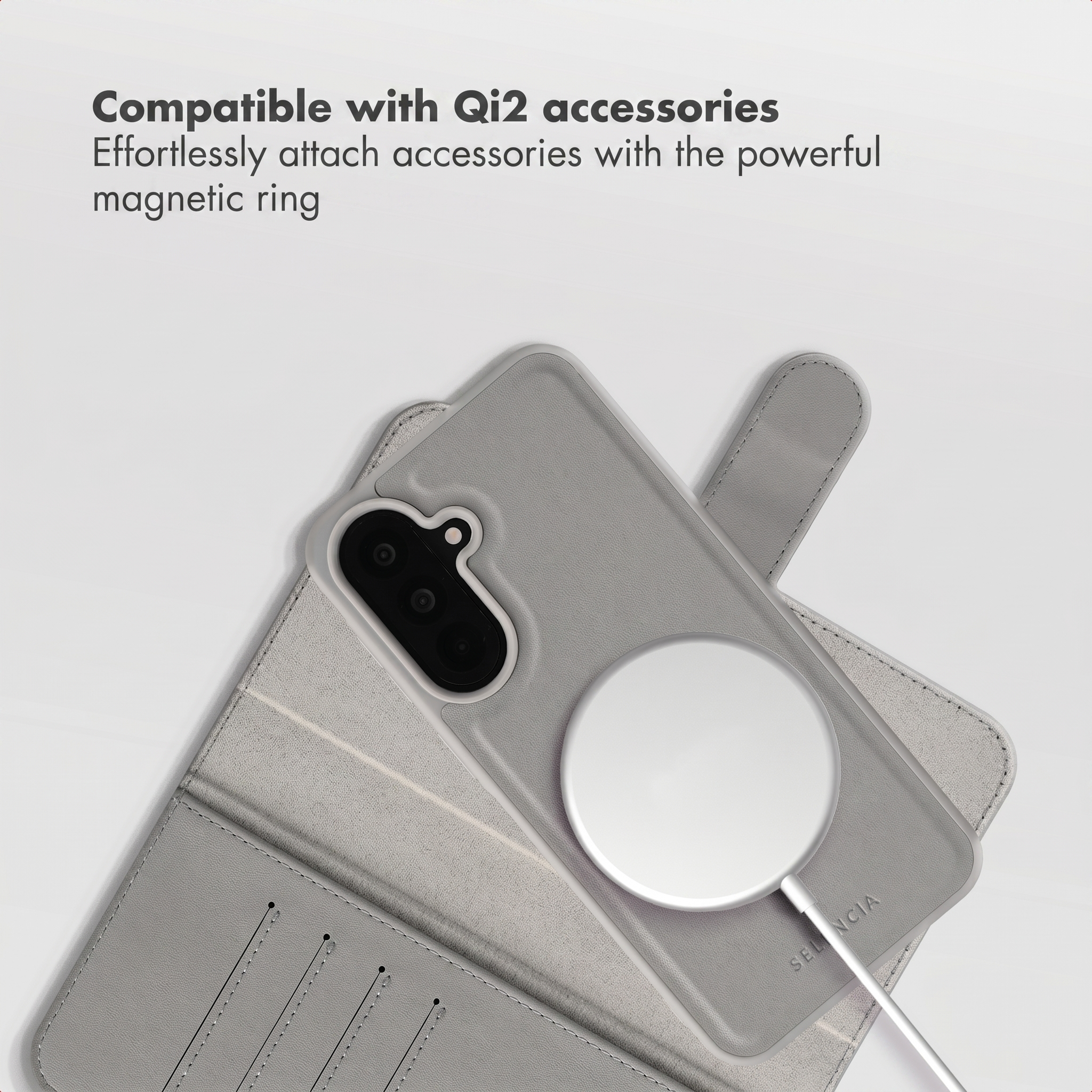 Grey phone case with a wireless charger on a white background.
