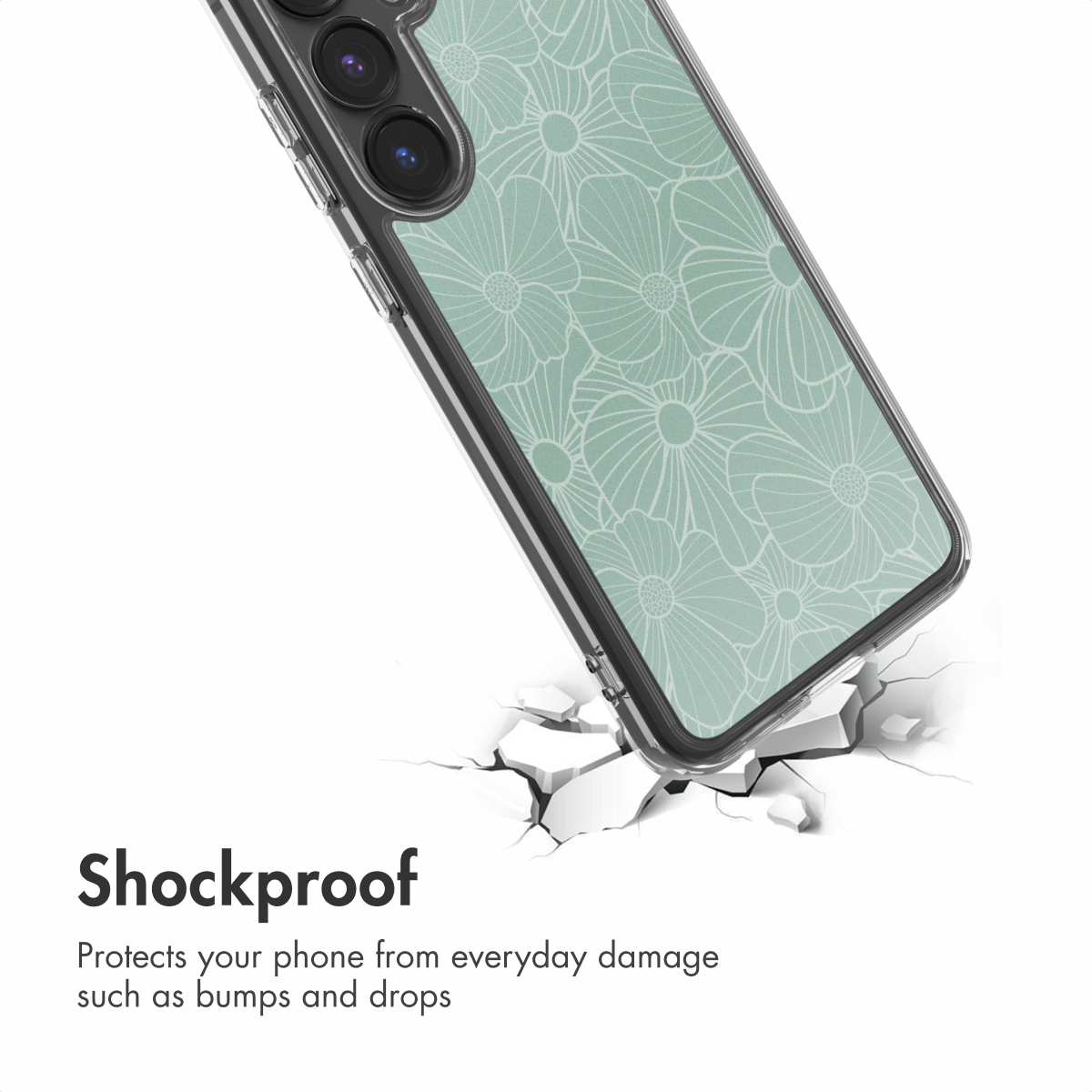 Una funda de móvil resistente a golpes con patrón floral verde menta sobre una superficie blanca agrietada.