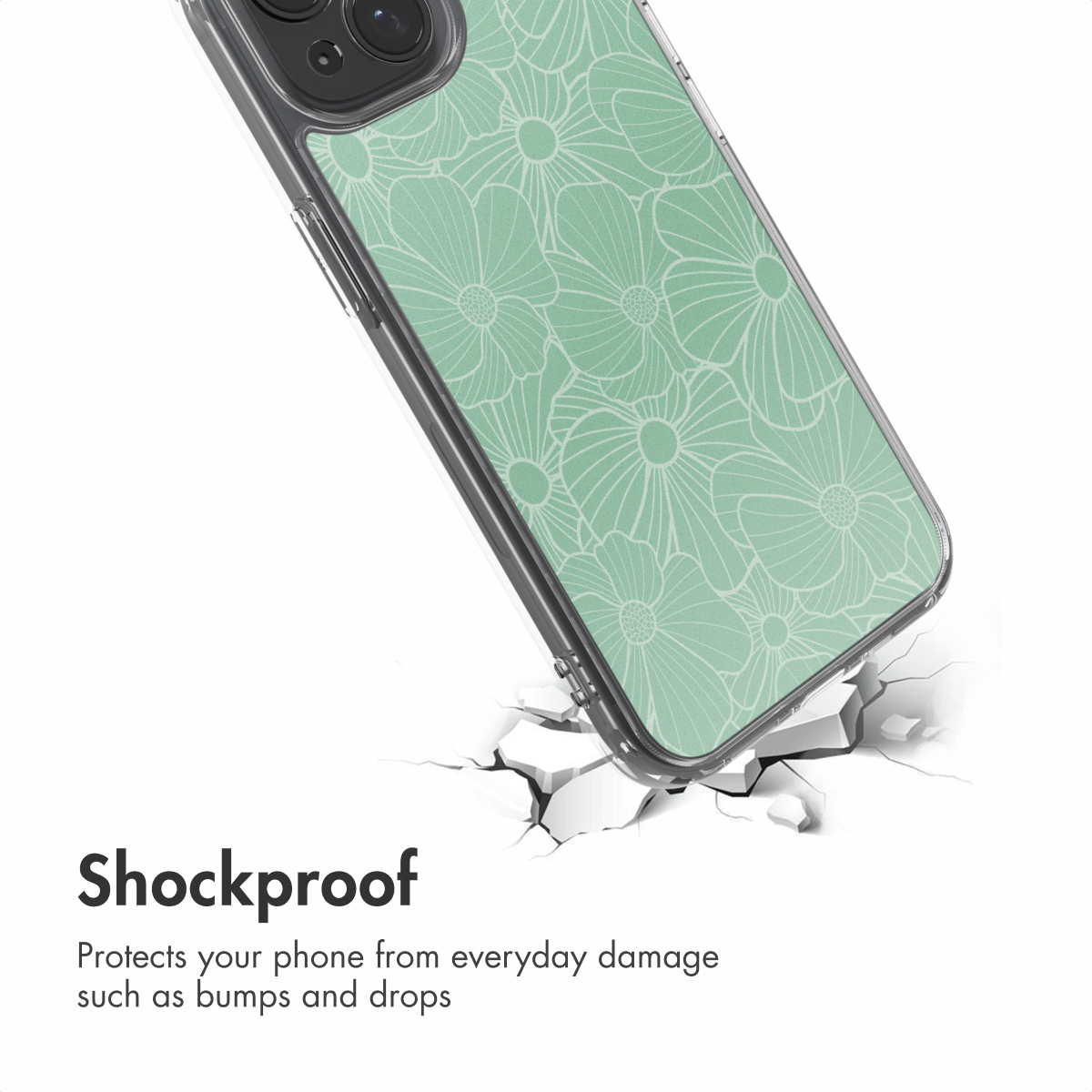 Een smartphone in een mintgroene bloemenbeschermhoes boven een barstend wit oppervlak.