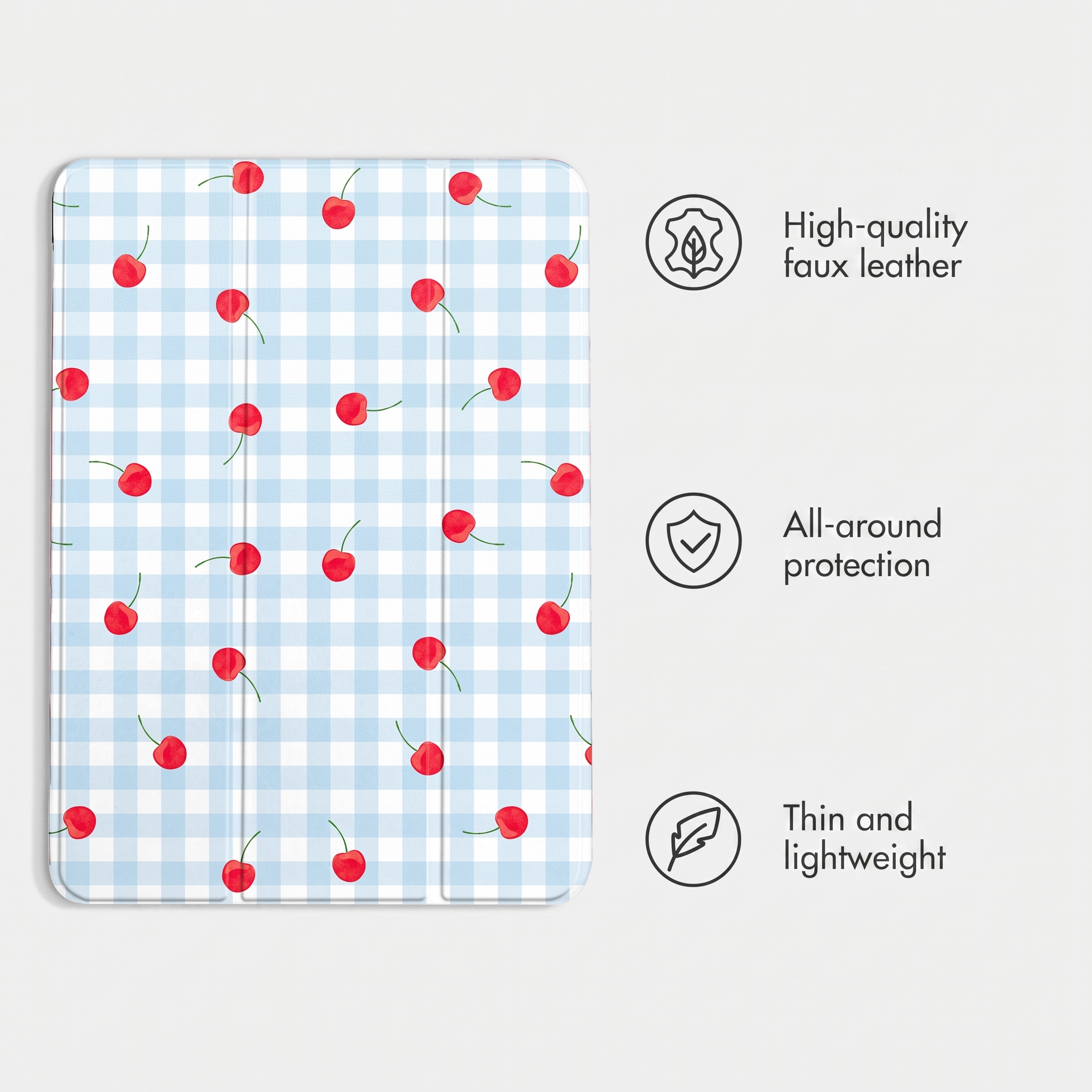 Custodia per tablet a quadri blu con ciliegie rosse, accanto a tre icone con testo su pelle, protezione e peso.