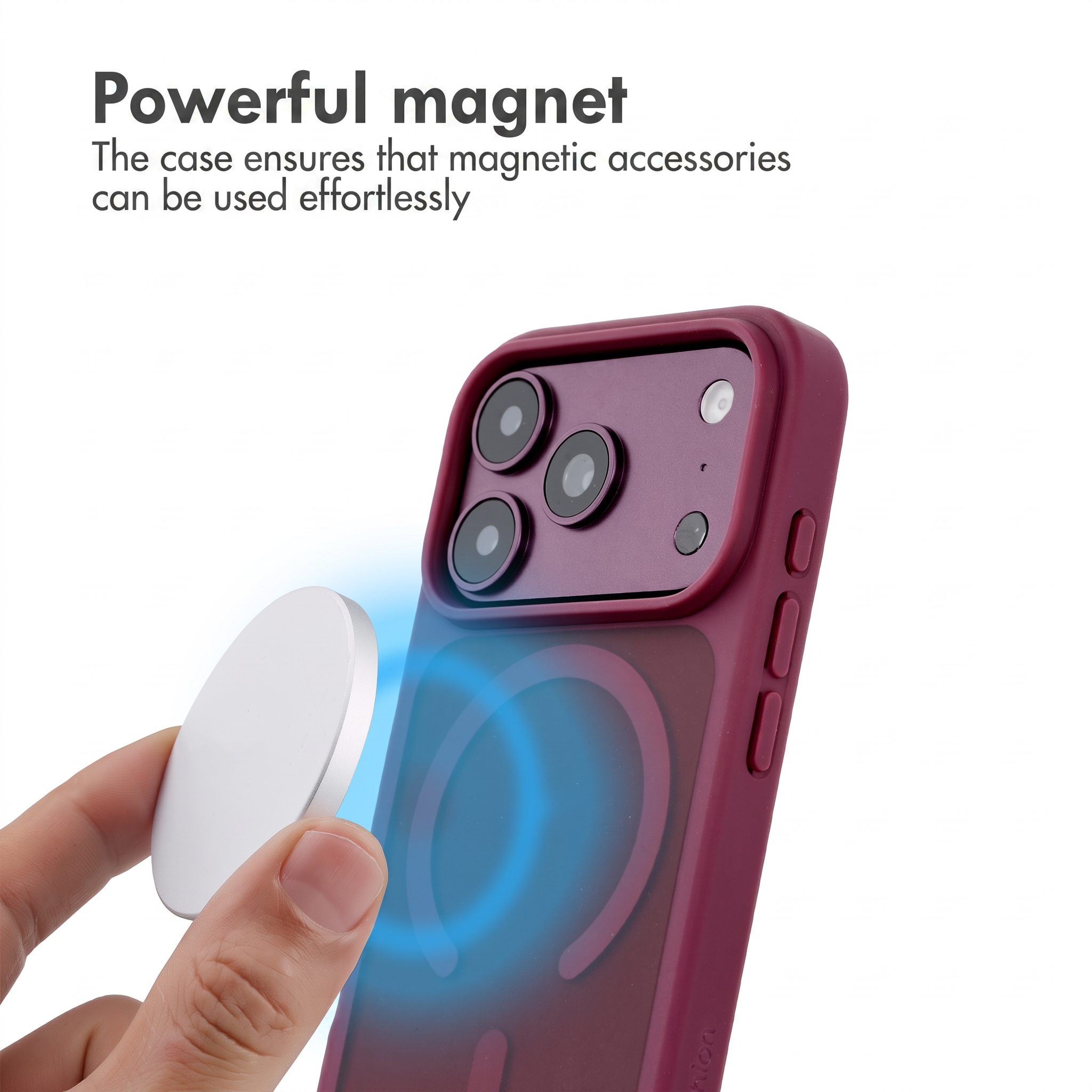 Telefono in una custodia rossa mentre viene applicato un magnete rotondo.
