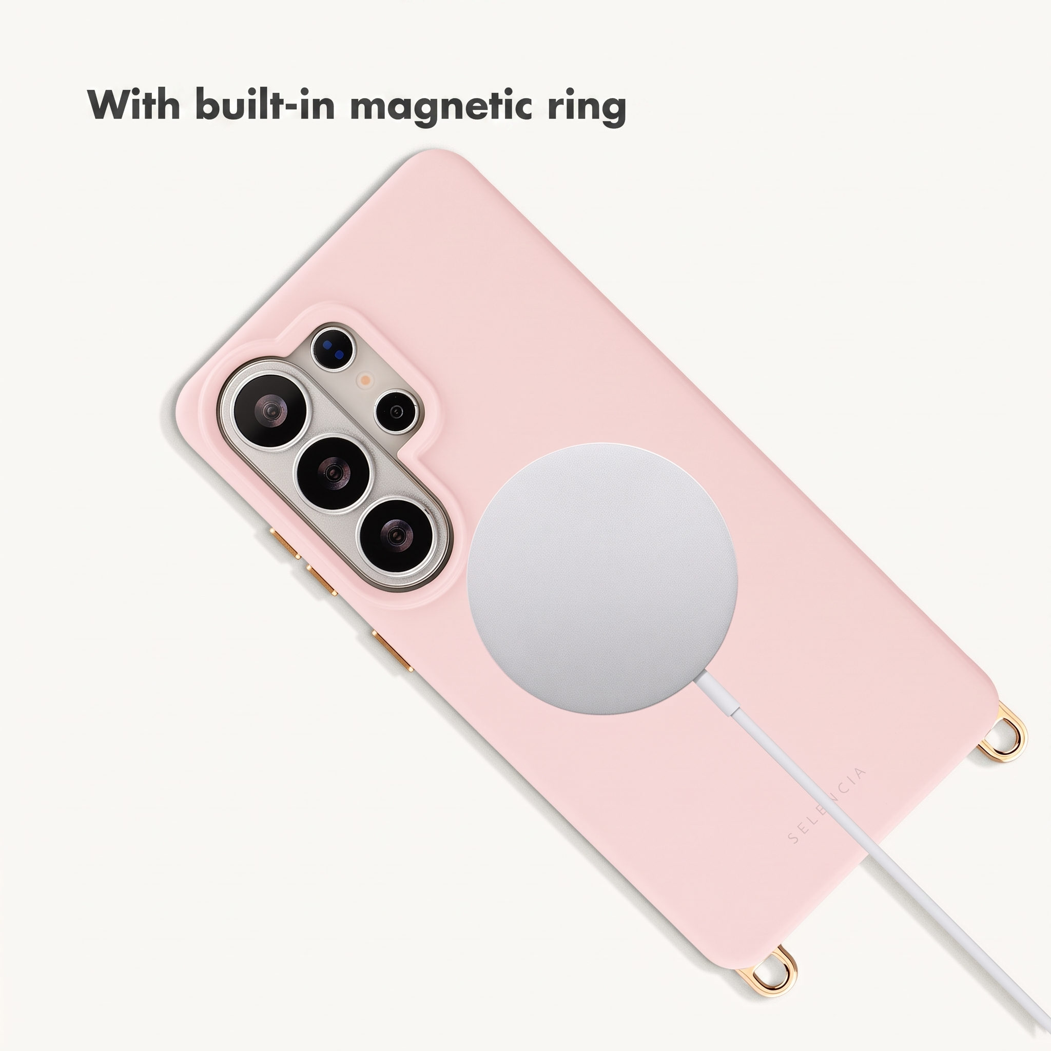 Coque de téléphone rose avec anneau magnétique argenté intégré et câble de charge sur fond blanc.