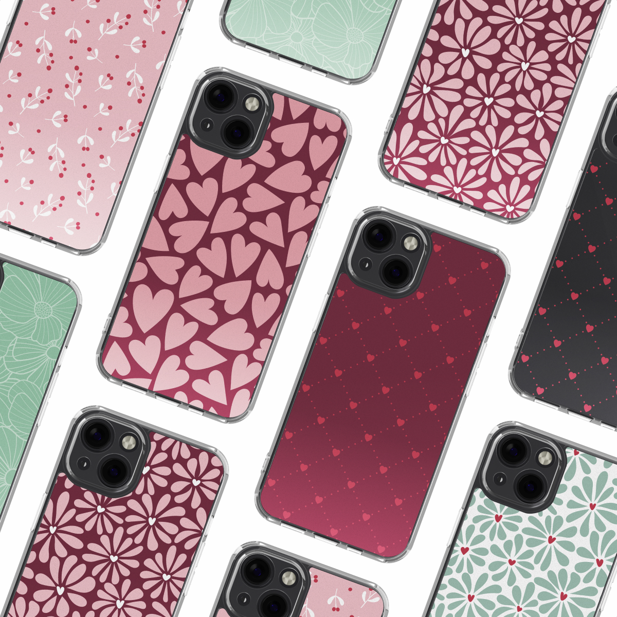 Mehrere bunte Smartphone-Hüllen mit verschiedenen Mustern wie Herzen und Blumen angeordnet.