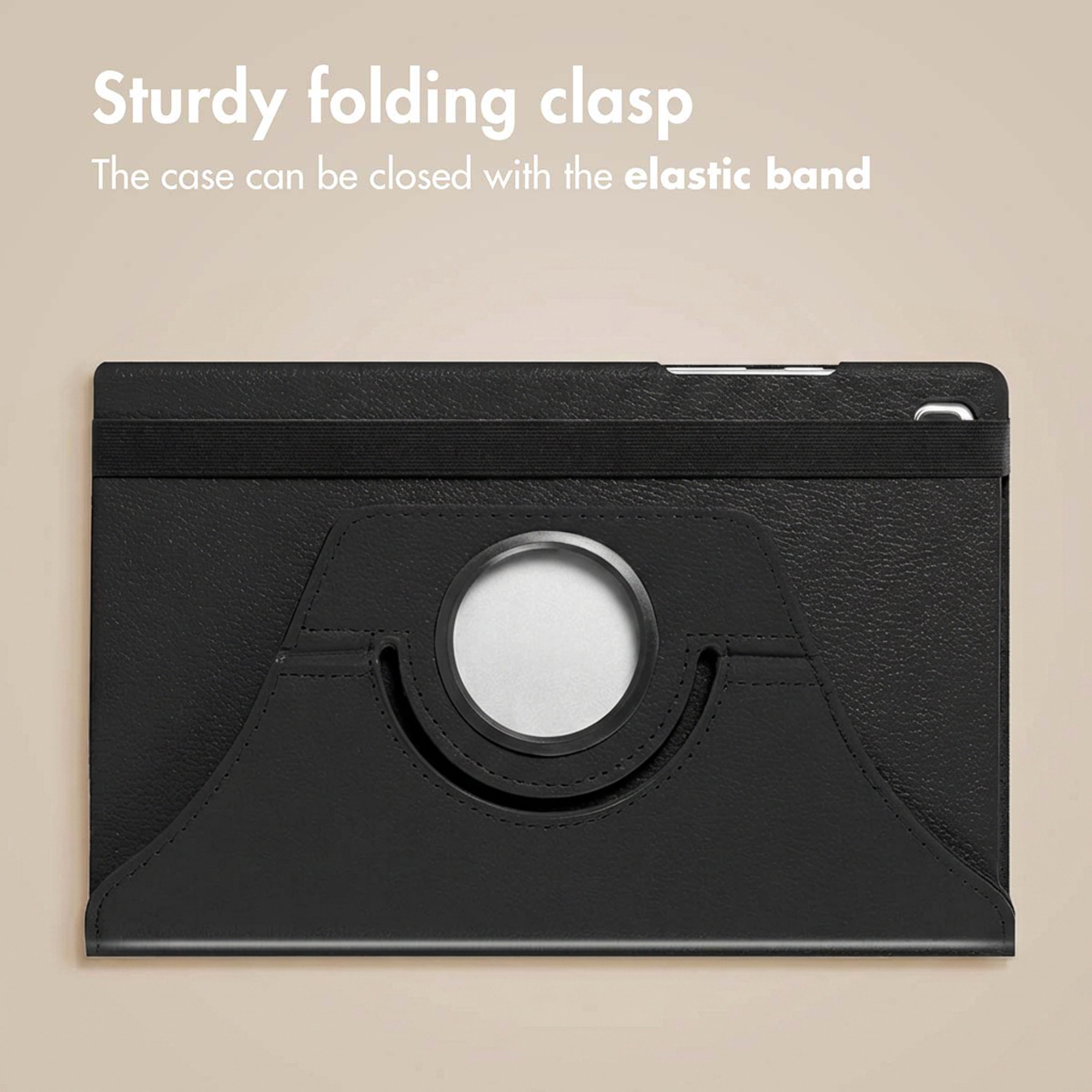 A black tablet case with a circular stand and a secure elastic band closure against a beige background.