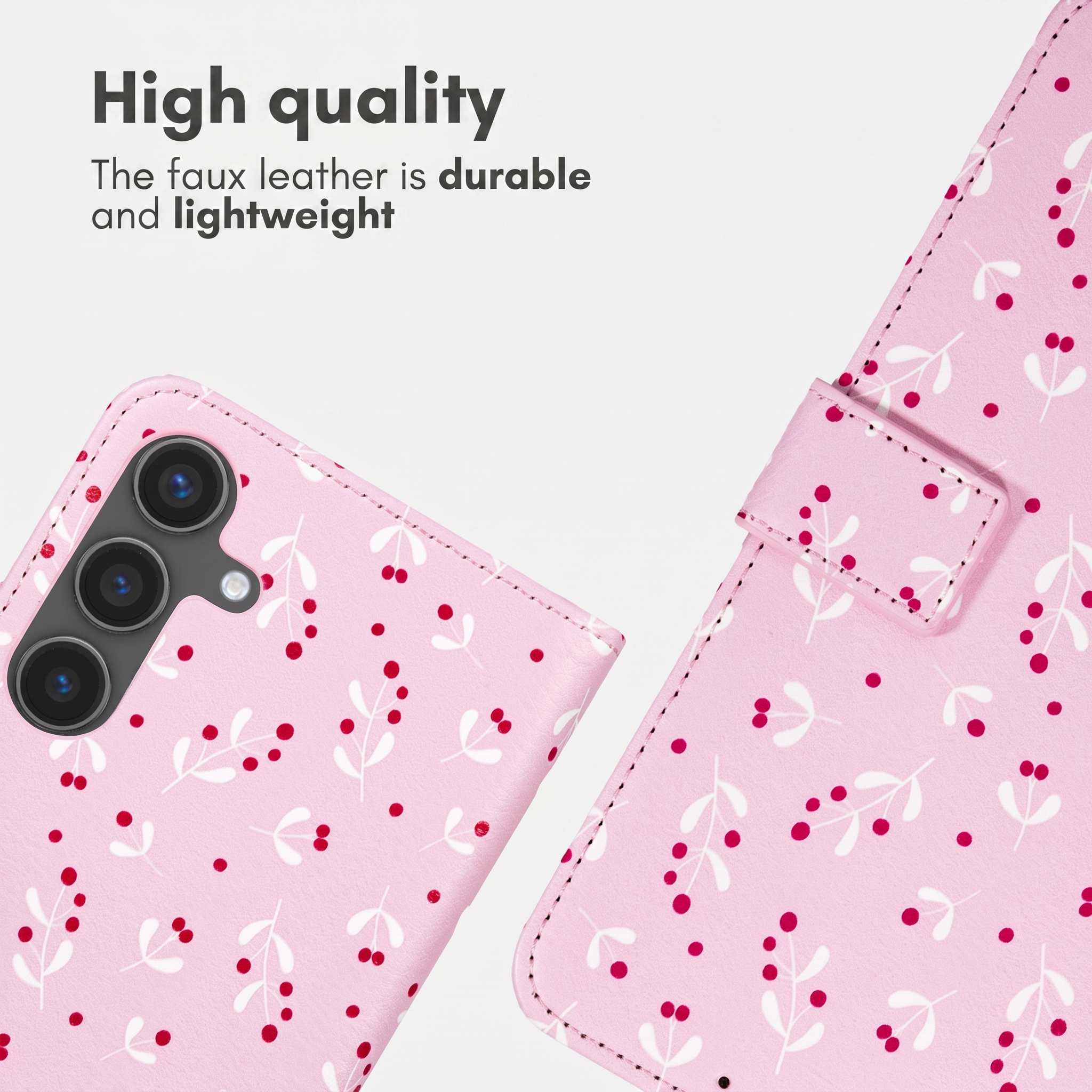 Roze kunstleren telefoonhoesje met een wit takje en rode bessenpatroon.