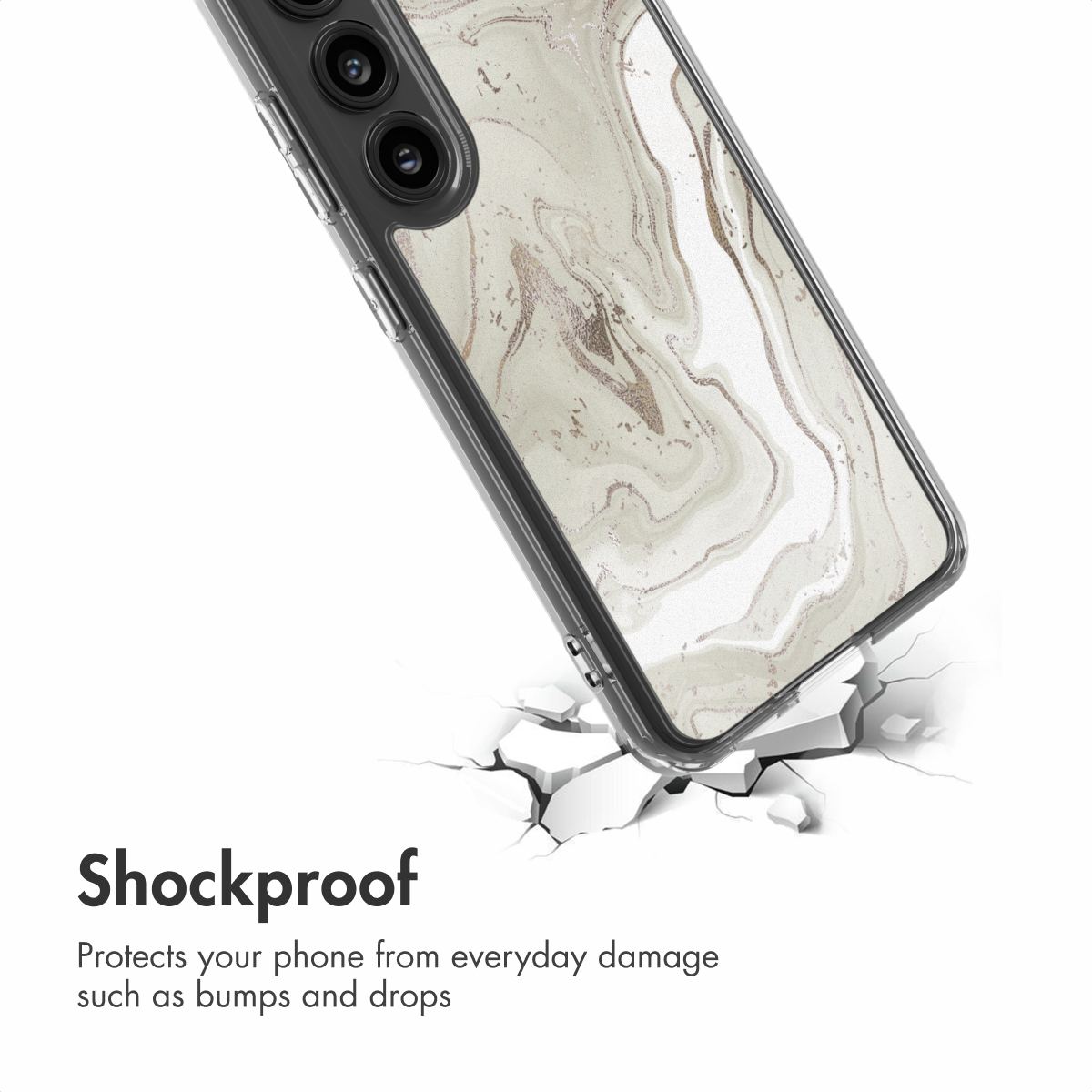 Un teléfono en una funda antigolpes con patrón de mármol blanco se apoya en una superficie agrietada.