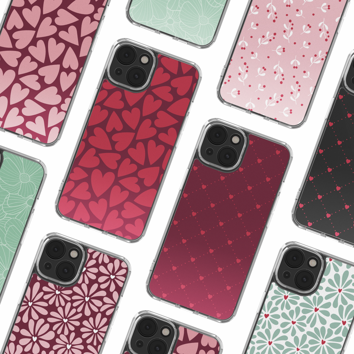 Varias fundas de teléfono con varios patrones como corazones, flores y bayas sobre un fondo blanco.