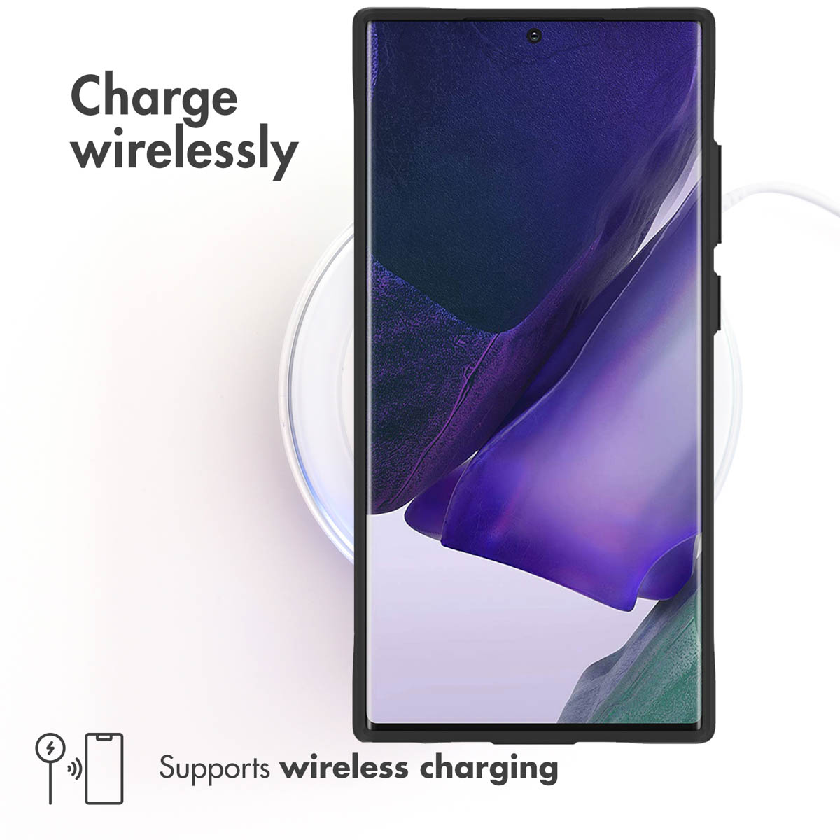 Uno smartphone poggia su una base di ricarica wireless rotonda. Testo: Charge wirelessly.