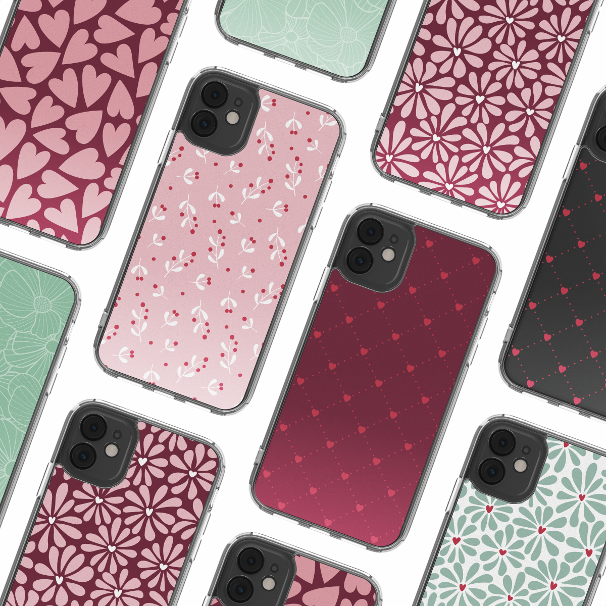 Diverse custodie per smartphone con motivi colorati di cuori e fiori su sfondo bianco.