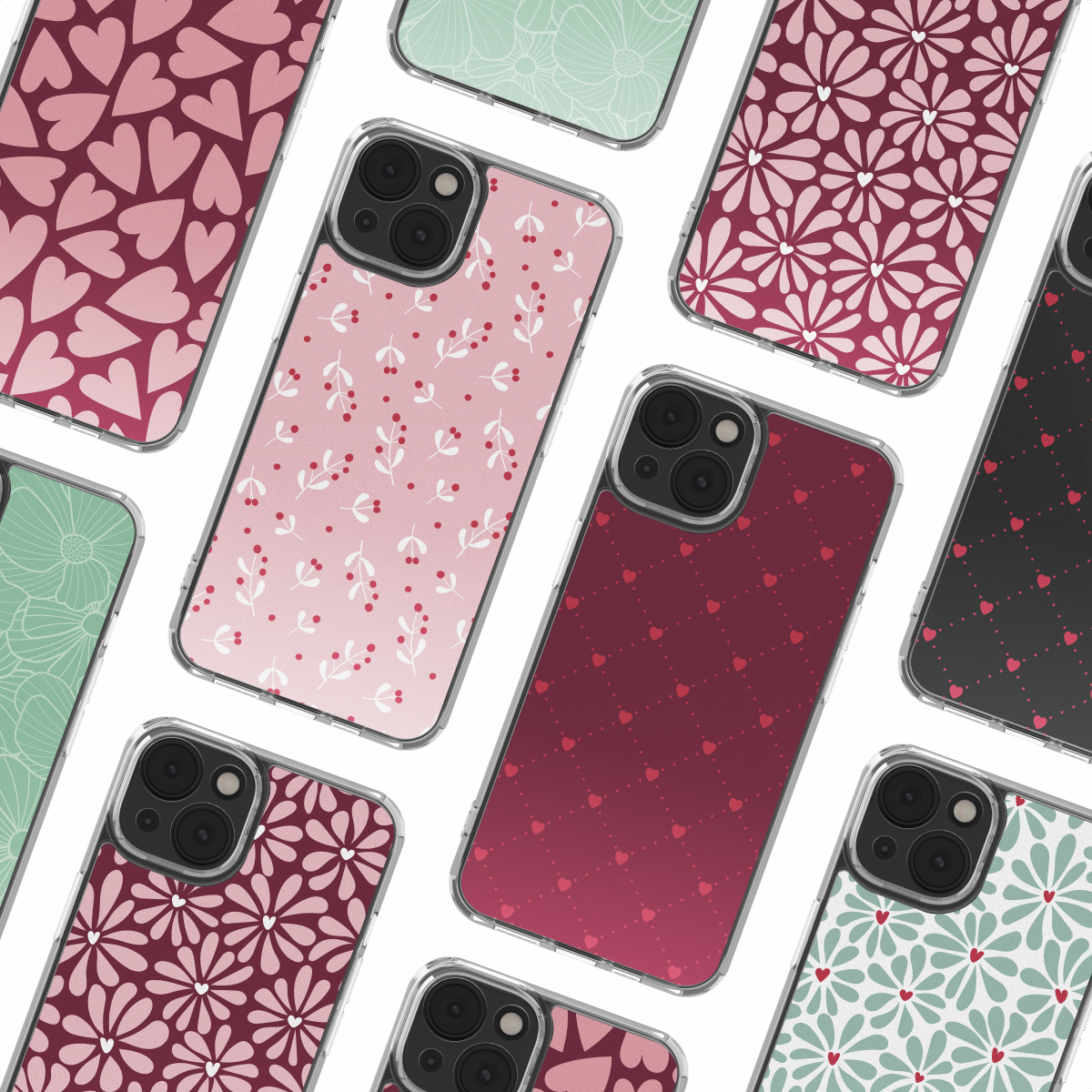 Varios teléfonos inteligentes con varios patrones coloridos como corazones y flores sobre un fondo blanco.