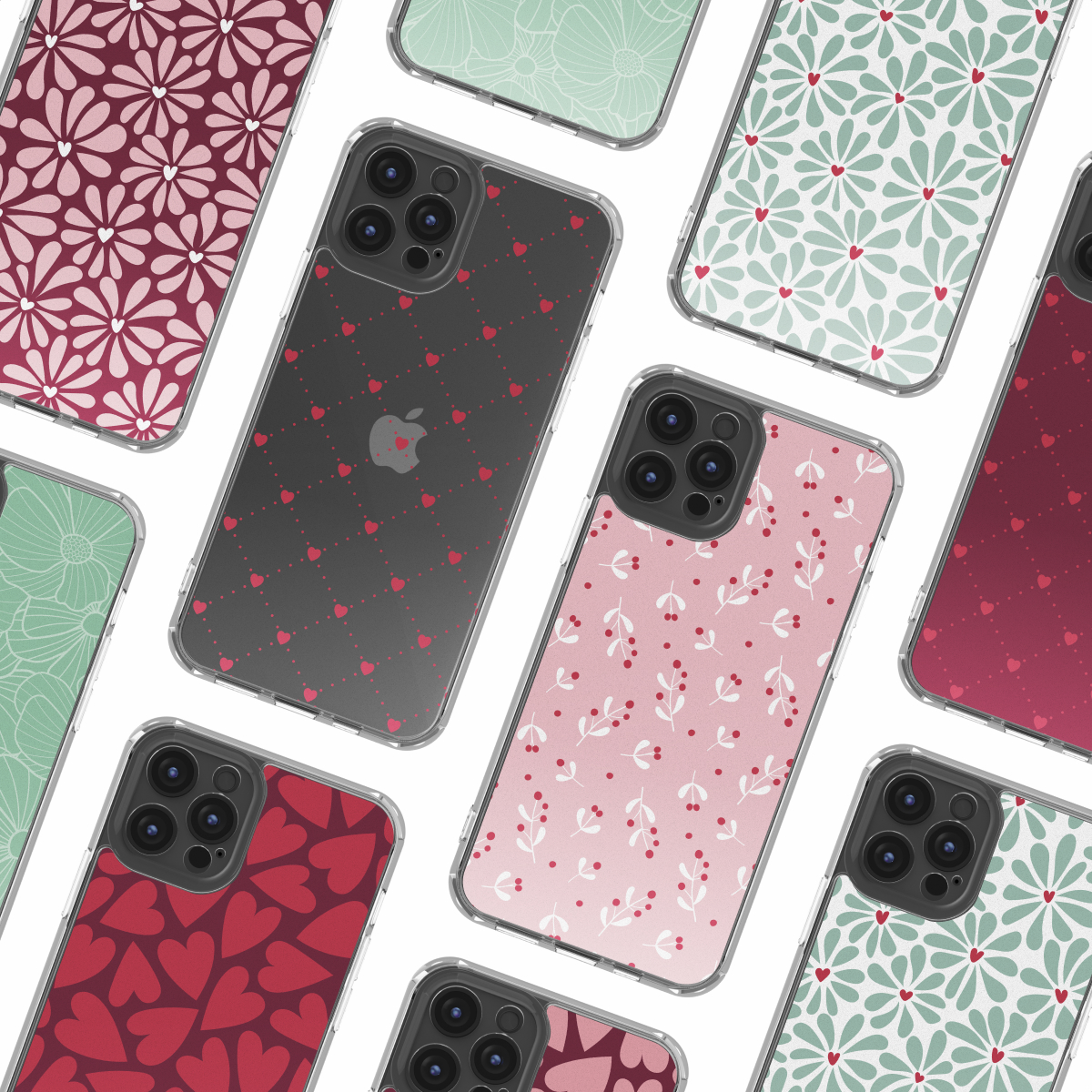Plusieurs smartphones avec des coques à motifs floraux, cœurs et pois sur fond blanc.