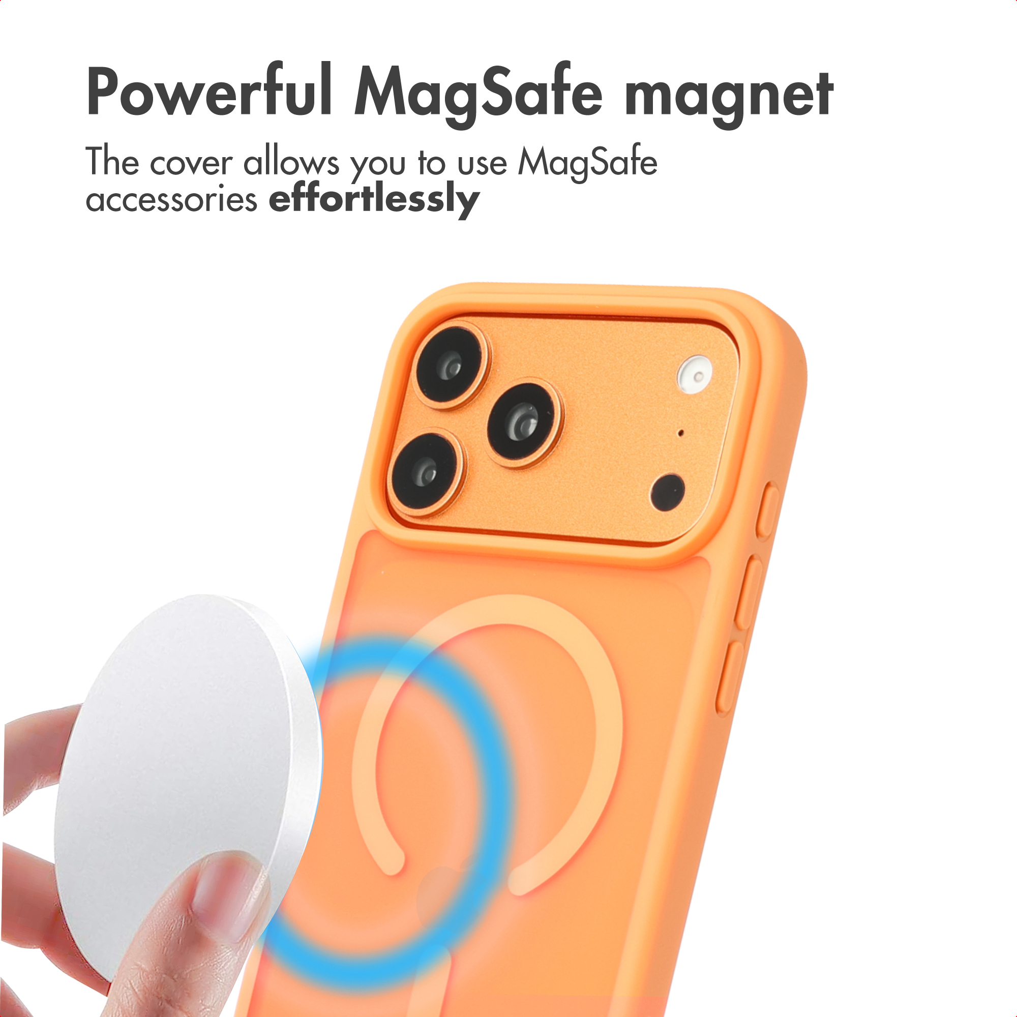Hand holds white MagSafe charger near orange phone with case and magnetic ring.