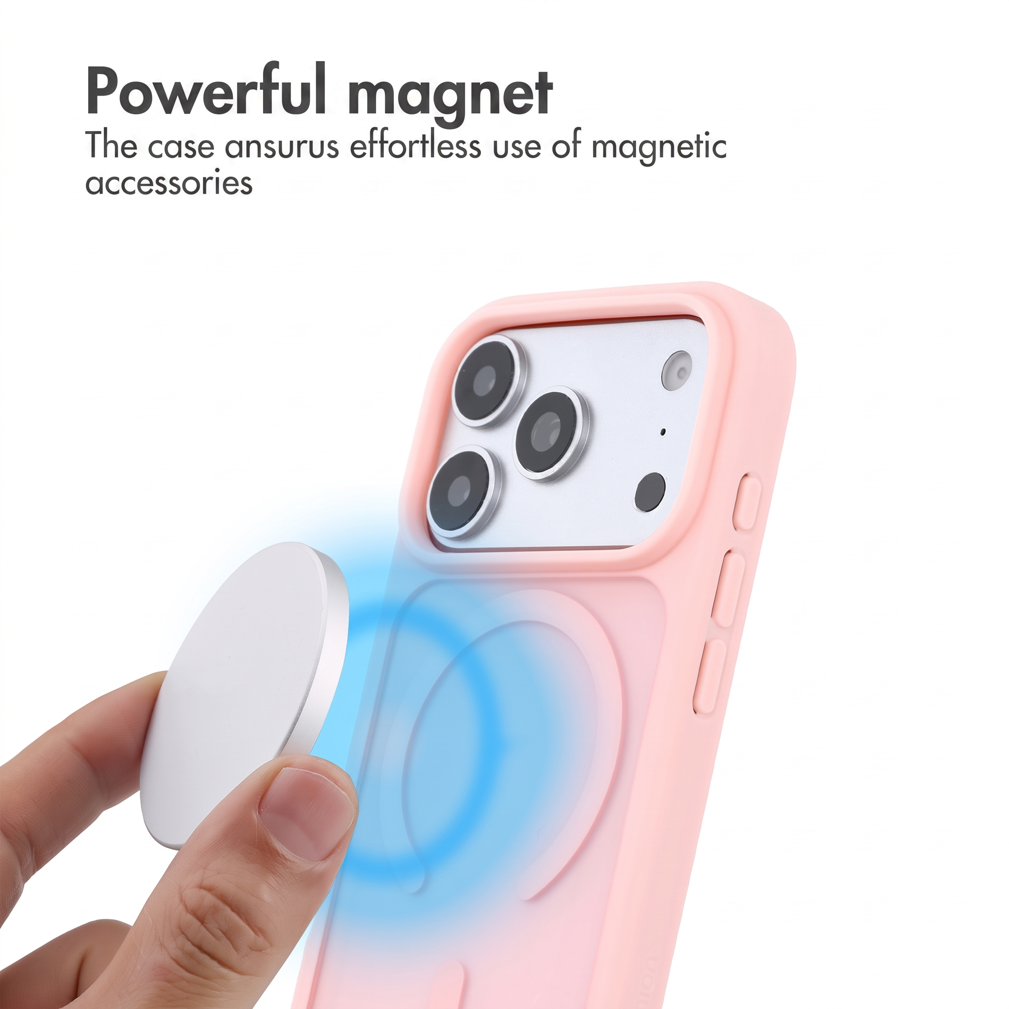 Mano che tiene un magnete rotondo vicino a una cover rosa con anello magnetico.