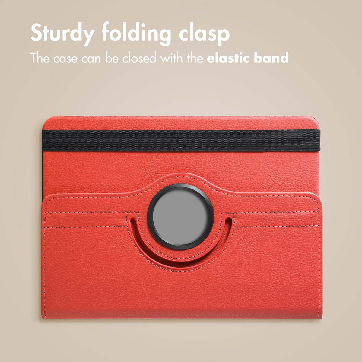 A red leather tablet case featuring a black elastic band and a central circular rotating mechanism.