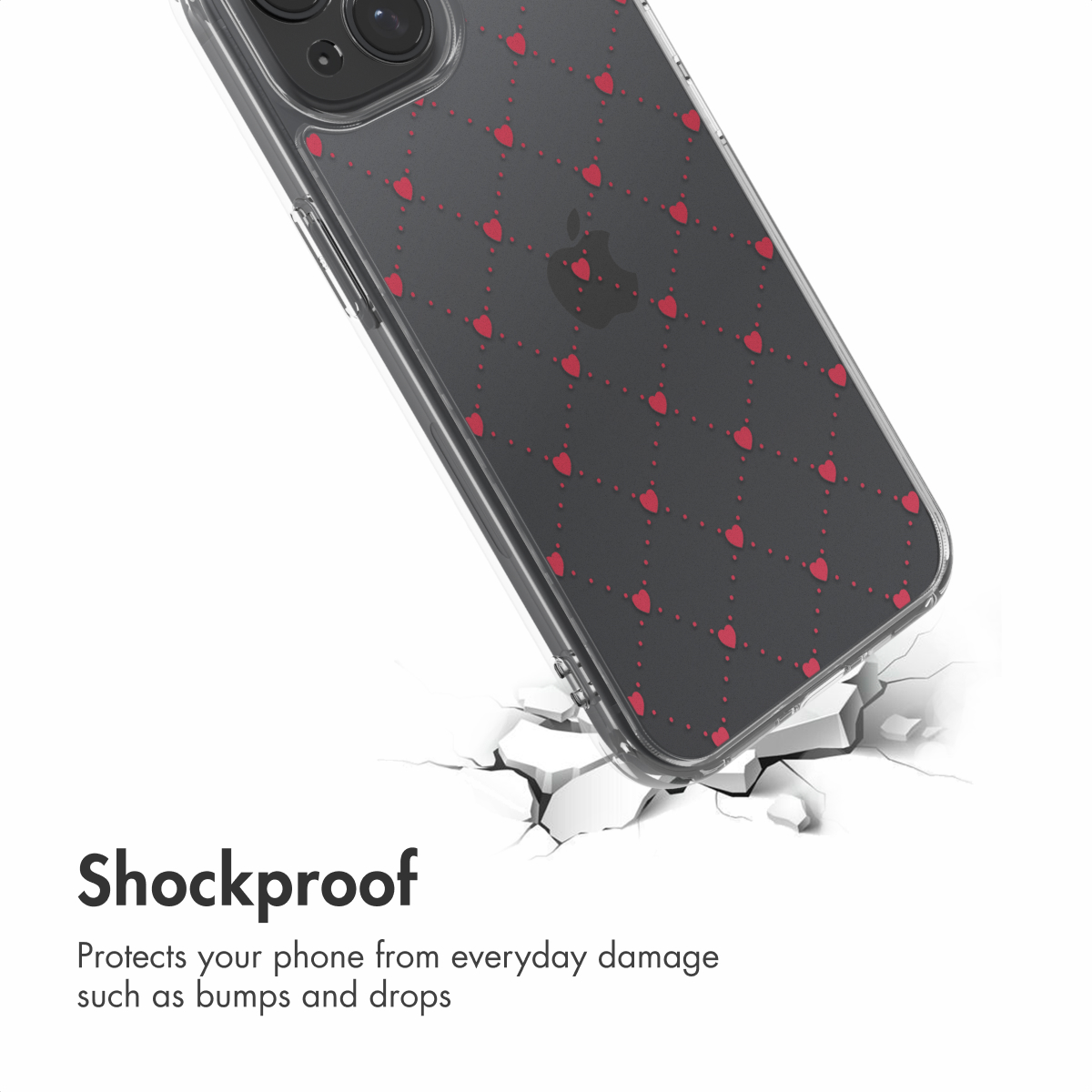 Schokbestendige telefoonhoes met rode harten op een donkere achtergrond, rustend op een gebarsten oppervlak.