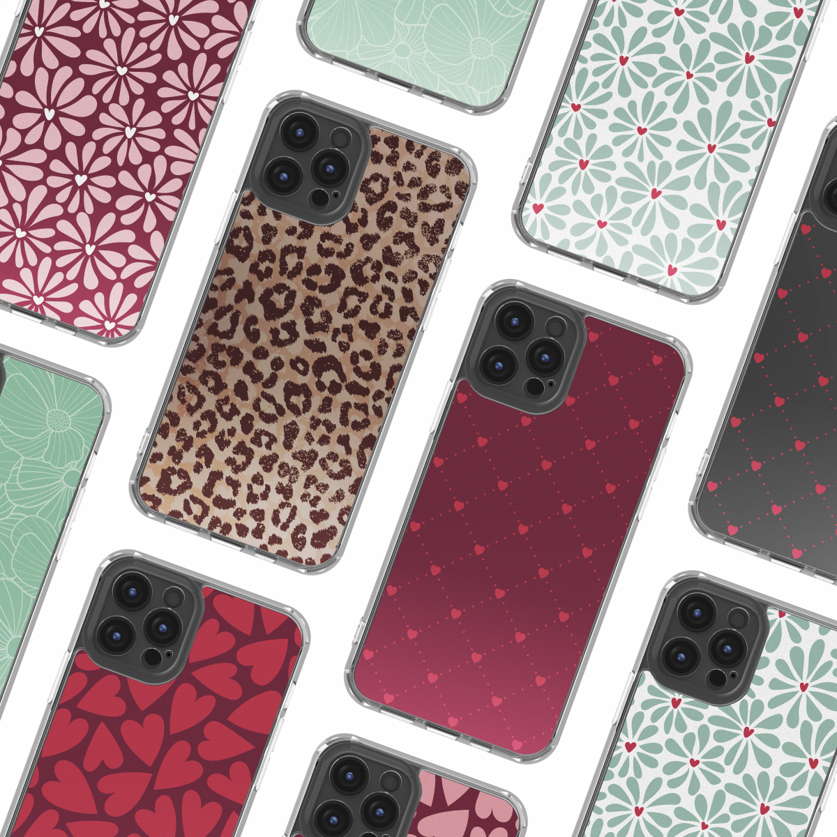 Una disposición de varias fundas para teléfonos inteligentes con varios diseños estampados que incluyen flores, corazones y estampado de leopardo.