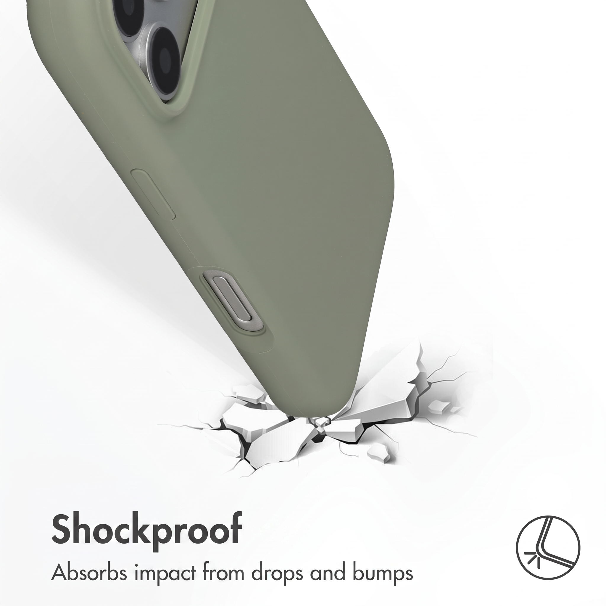 Un smartphone vert olive dans une coque de protection heurtant une surface blanche fissurée.