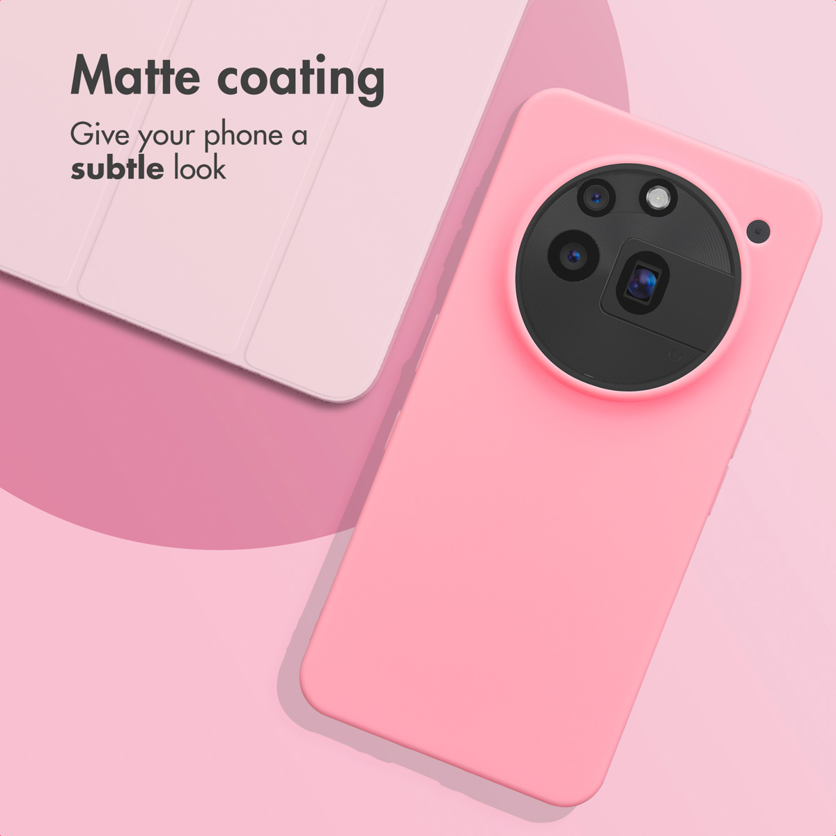 Un teléfono rosa con funda mate y gran módulo de cámara circular, junto a una tableta rosa sobre fondo rosa.