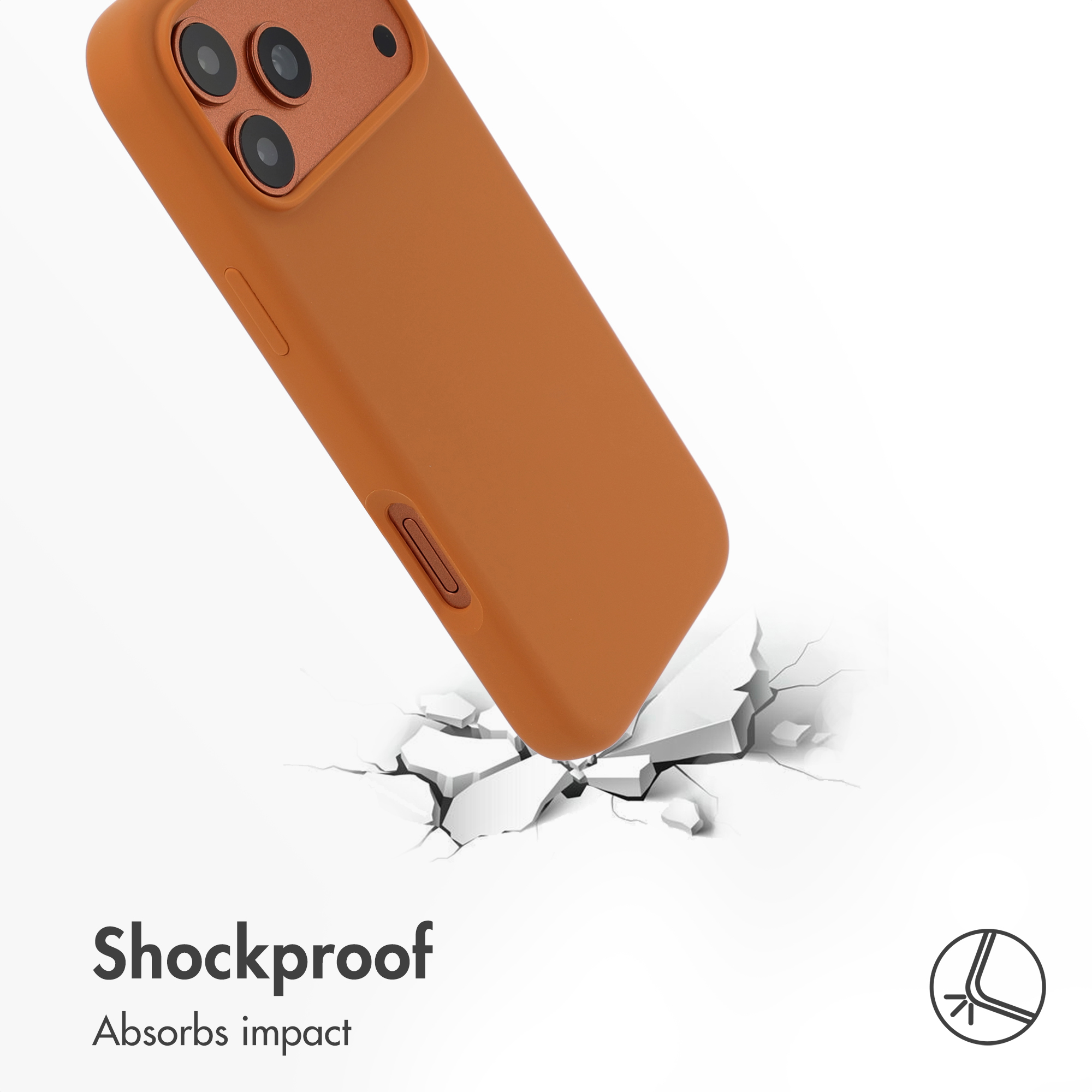 Un smartphone naranja con funda golpea un suelo blanco agrietado, ilustrando resistencia.