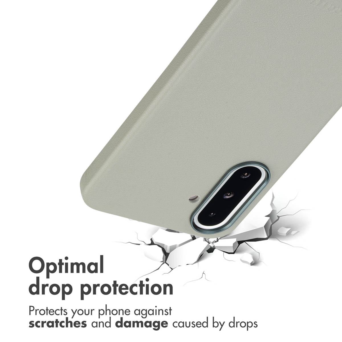 Un teléfono con funda protectora sobre una superficie blanca rota y texto sobre protección contra caídas.