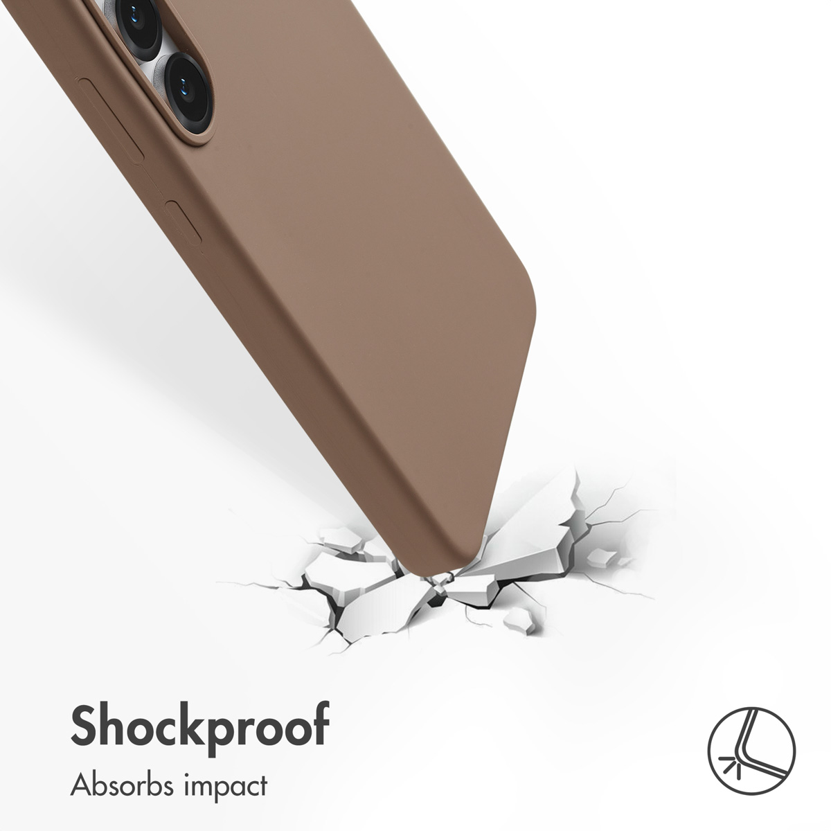 Uno smartphone marrone in una custodia protettiva colpisce una superficie dura e screpolata, mostrando resistenza.