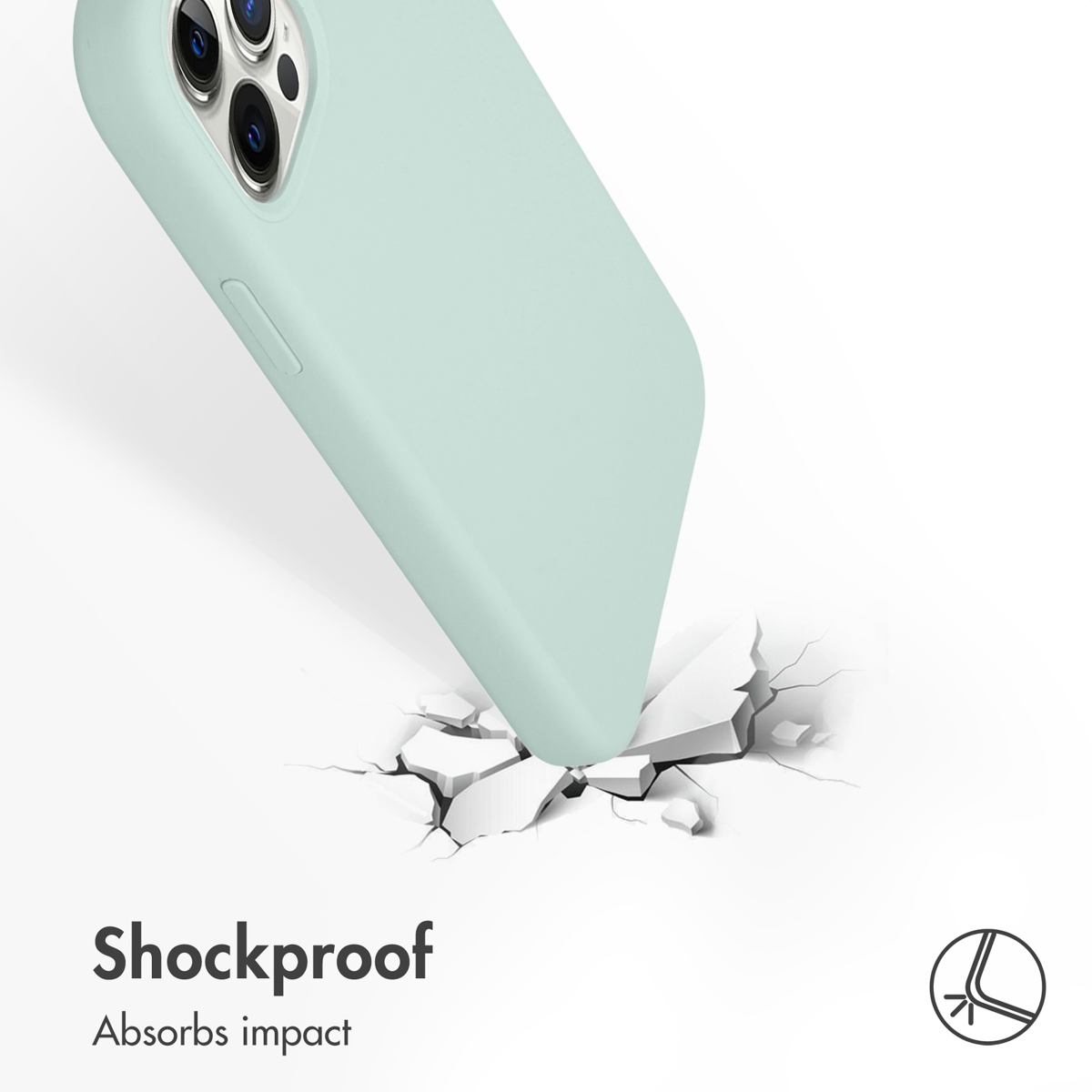 Miętowy smartfon w etui uderza w białą powierzchnię, pękając ją. Tekst: Odporny na wstrząsy.